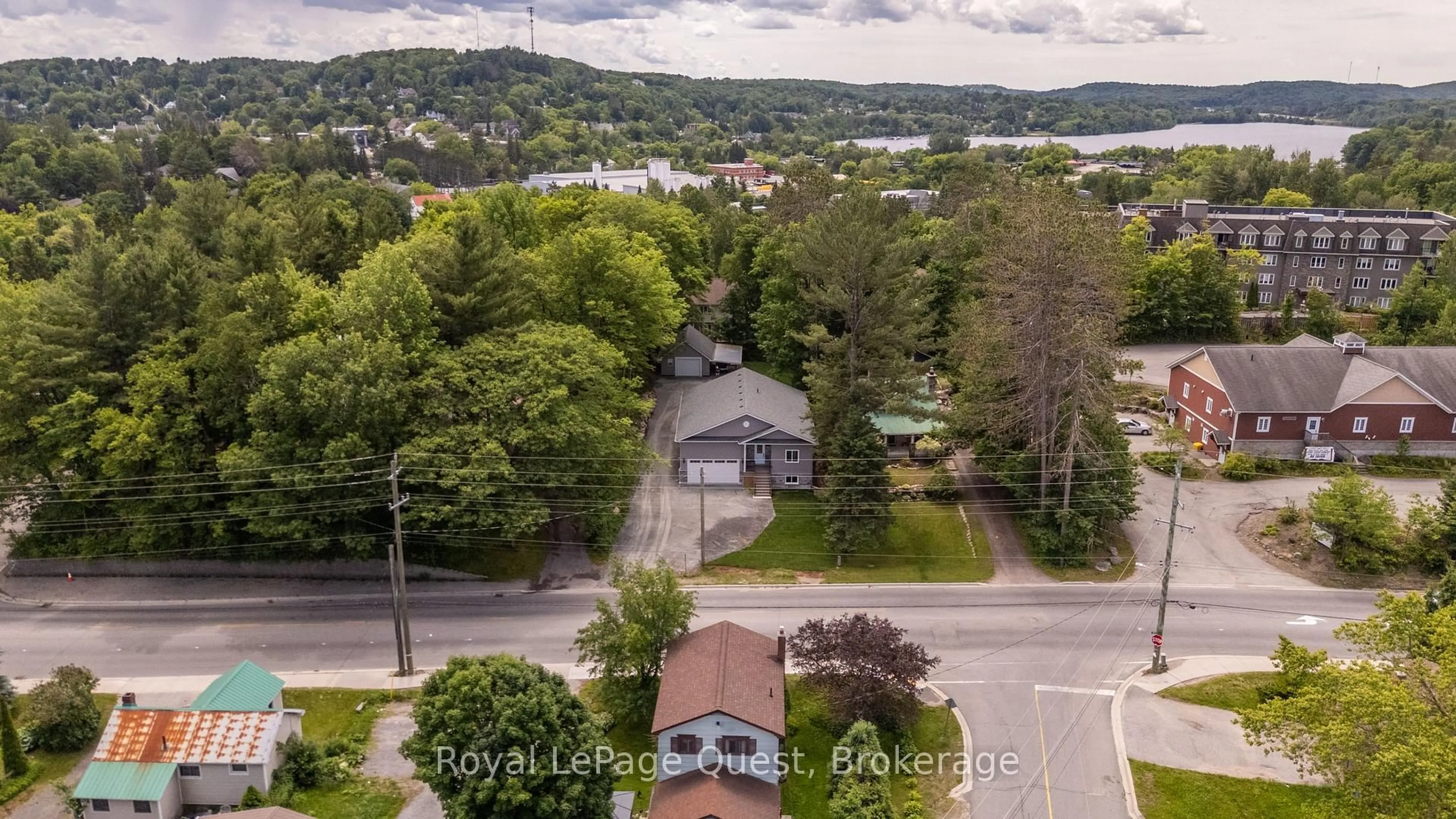 A pic from outside/outdoor area/front of a property/back of a property/a pic from drone, water/lake/river/ocean view for 57 West Rd, Huntsville Ontario P1H 1L4