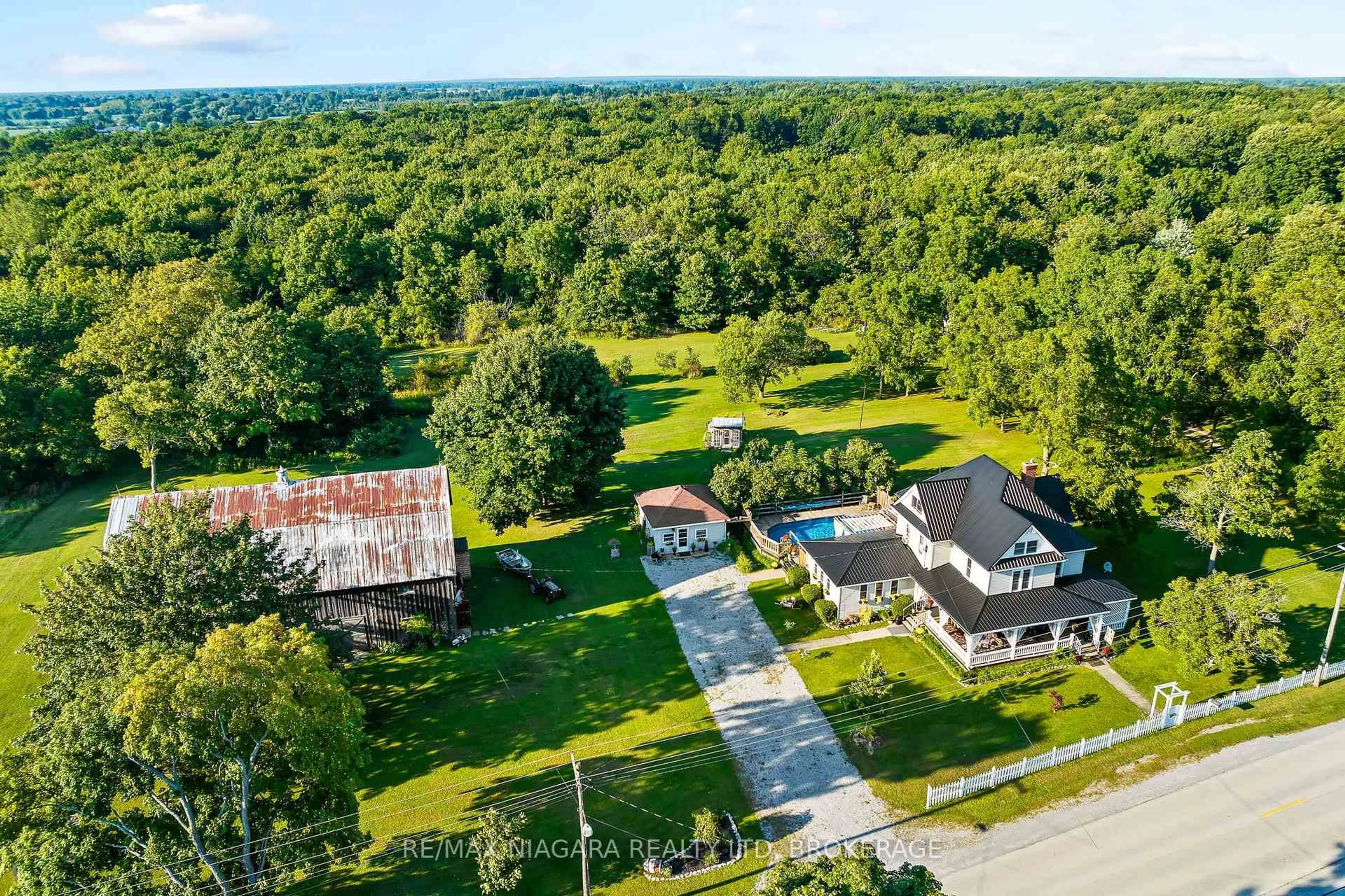 A pic from outside/outdoor area/front of a property/back of a property/a pic from drone, street for 11562 Lakeshore Rd, Wainfleet Ontario L3K 5V4