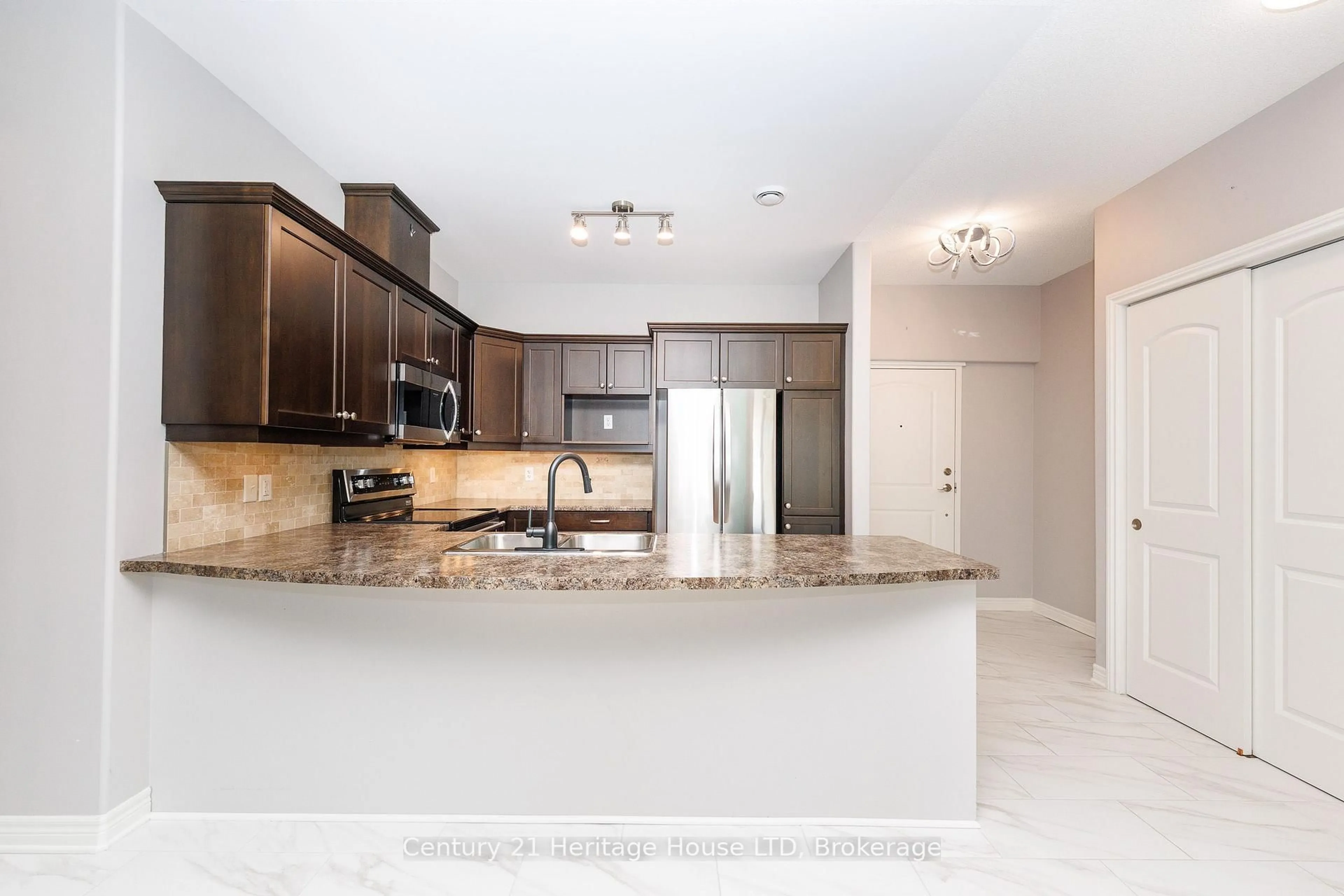 Open concept kitchen, ceramic/tile floor for 2799 St. Paul Ave #311, Niagara Falls Ontario L2J 2L3