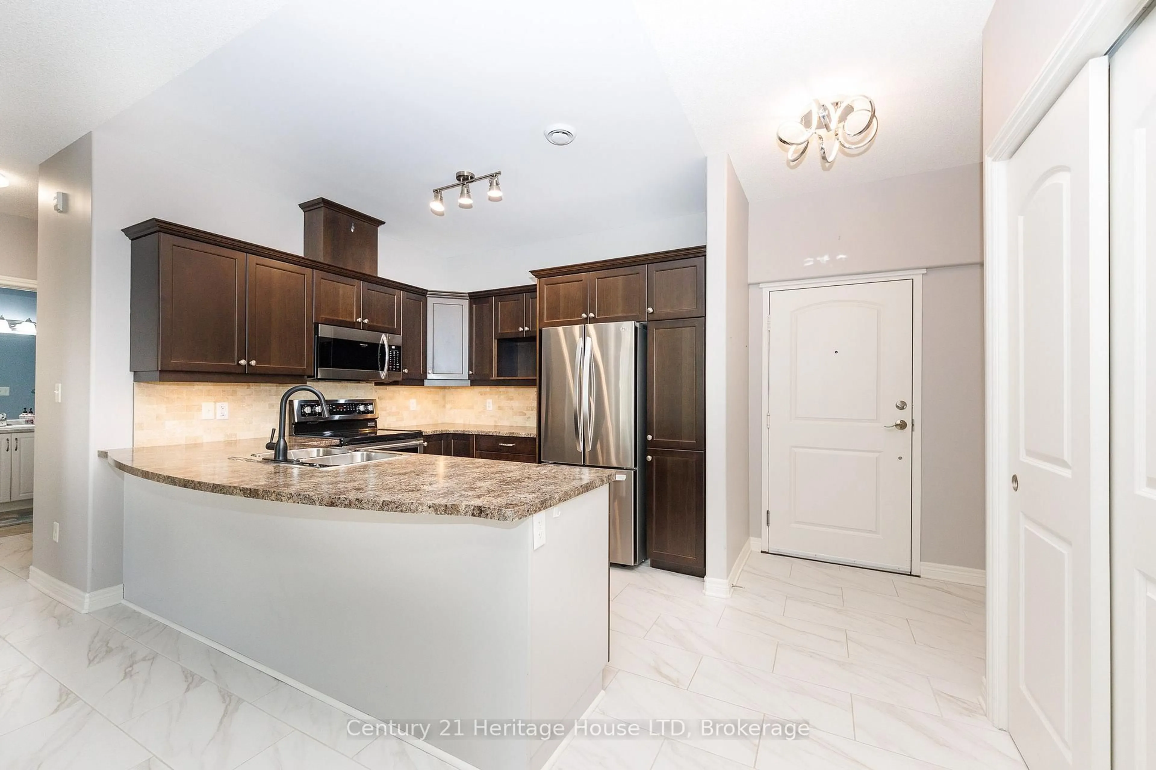 Open concept kitchen, ceramic/tile floor for 2799 St. Paul Ave #311, Niagara Falls Ontario L2J 2L3