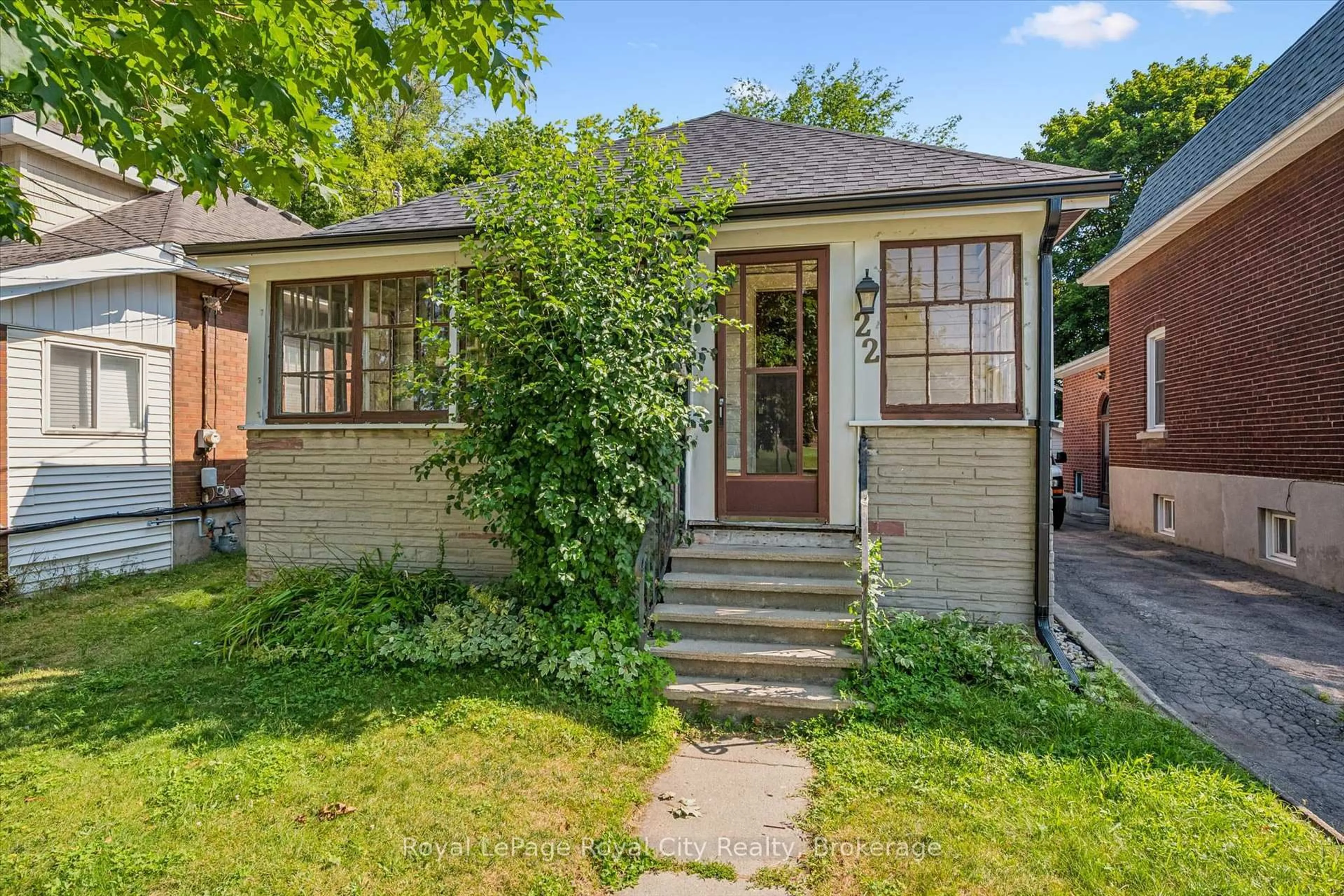 Home with brick exterior material, street for 22 Boult Ave, Guelph Ontario N1E 5W7