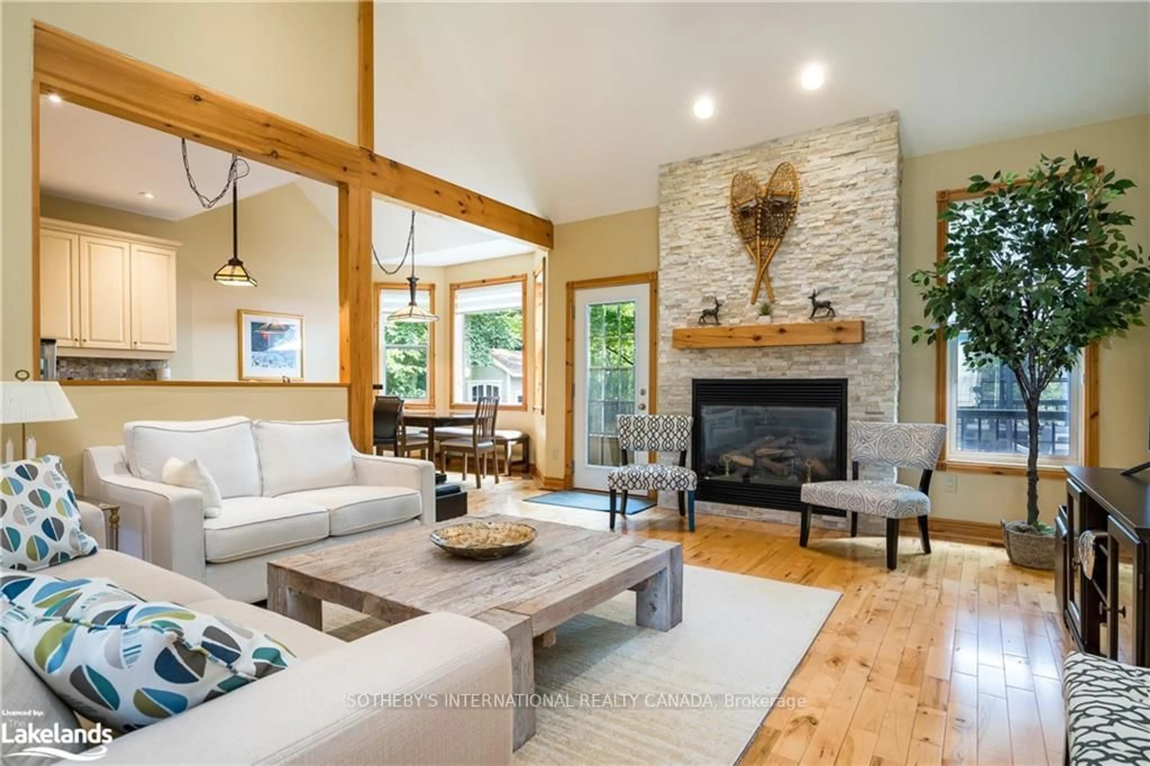 Living room with furniture, wood/laminate floor for 188 Brooker Blvd, Blue Mountains Ontario L9Y 0M2