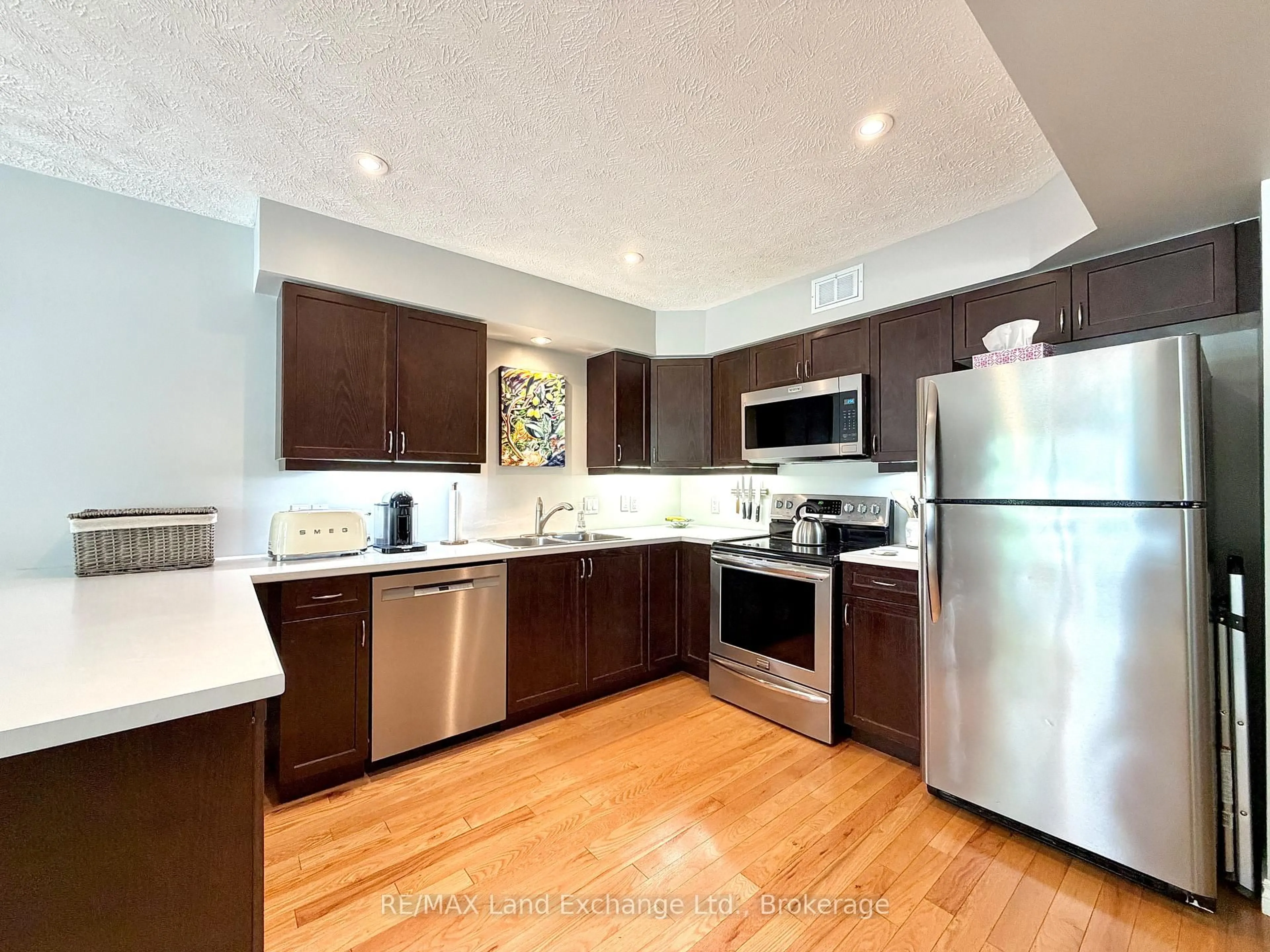 Open concept kitchen, wood/laminate floor for 203 STICKEL St, Saugeen Shores Ontario N0H 2C1