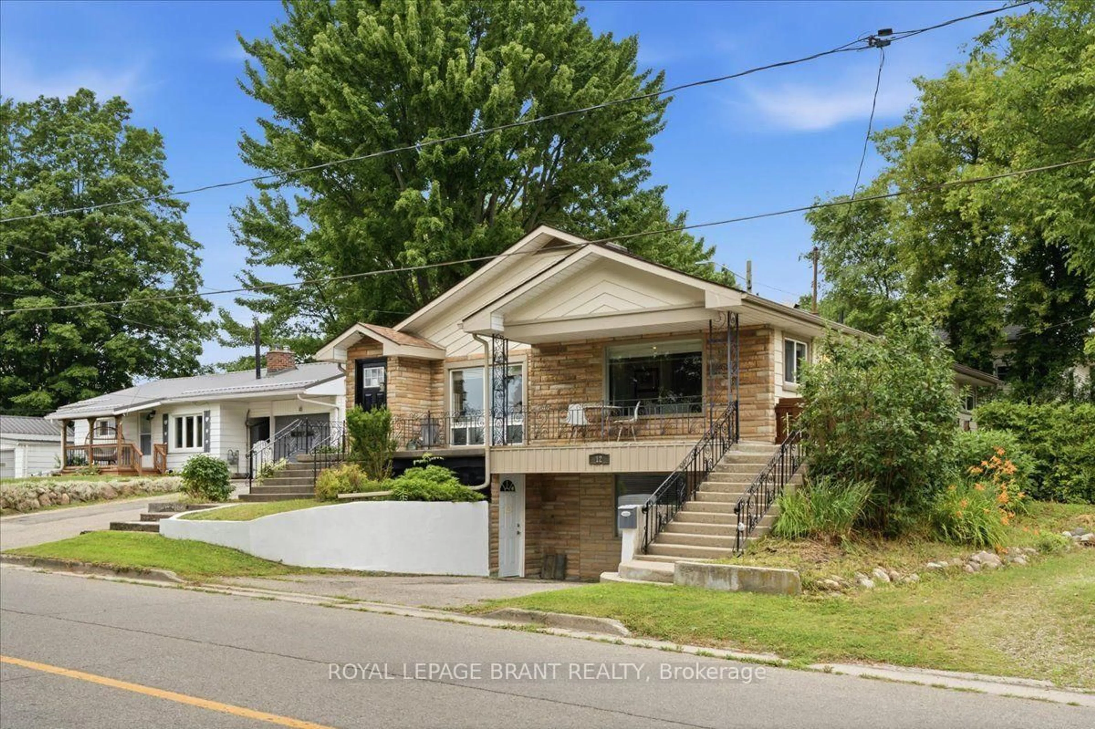 Home with vinyl exterior material, street for 12 Tillson St, Tillsonburg Ontario N4G 2X2