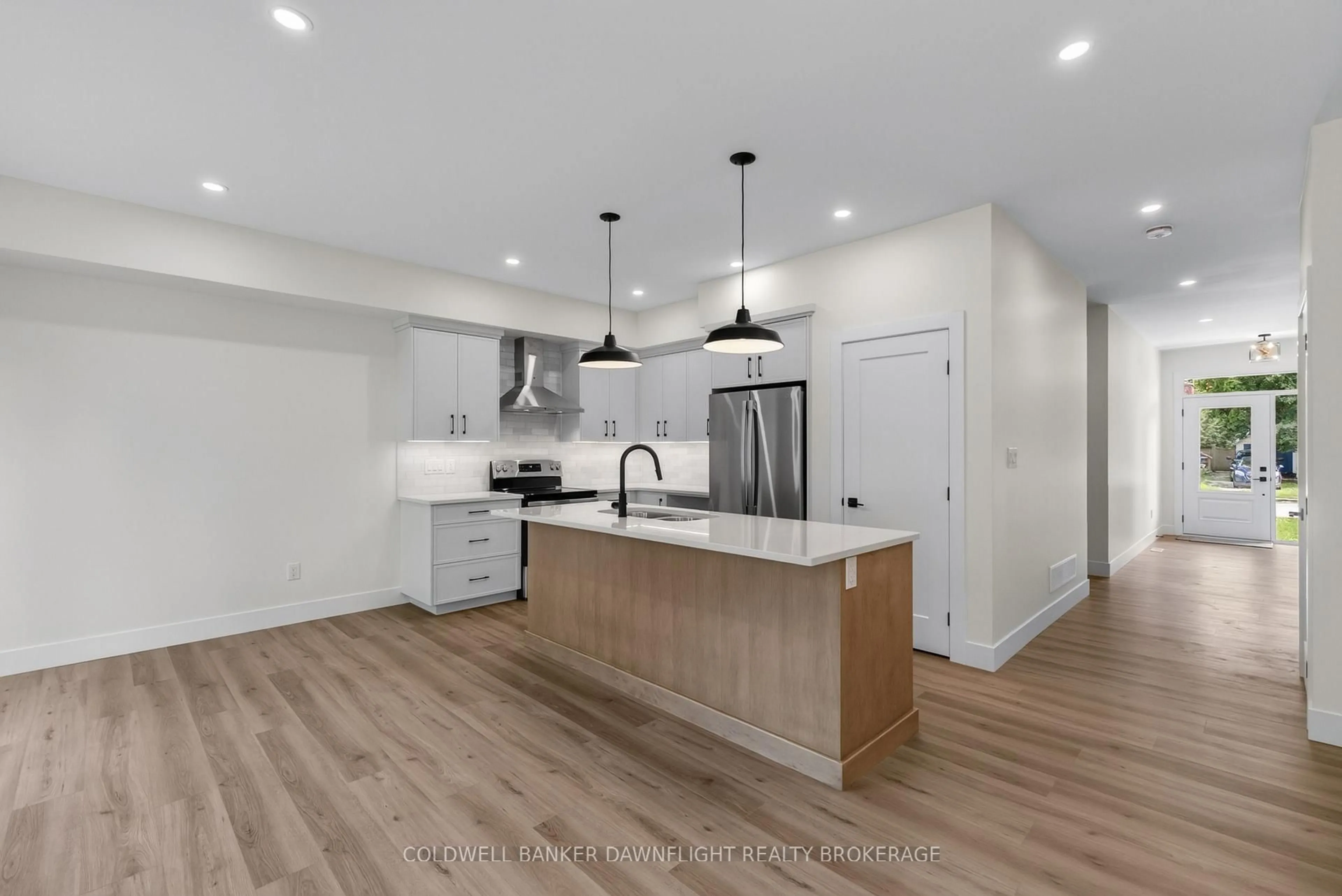 Open concept kitchen, wood/laminate floor for 119 James St, North Middlesex Ontario N0M 1A0