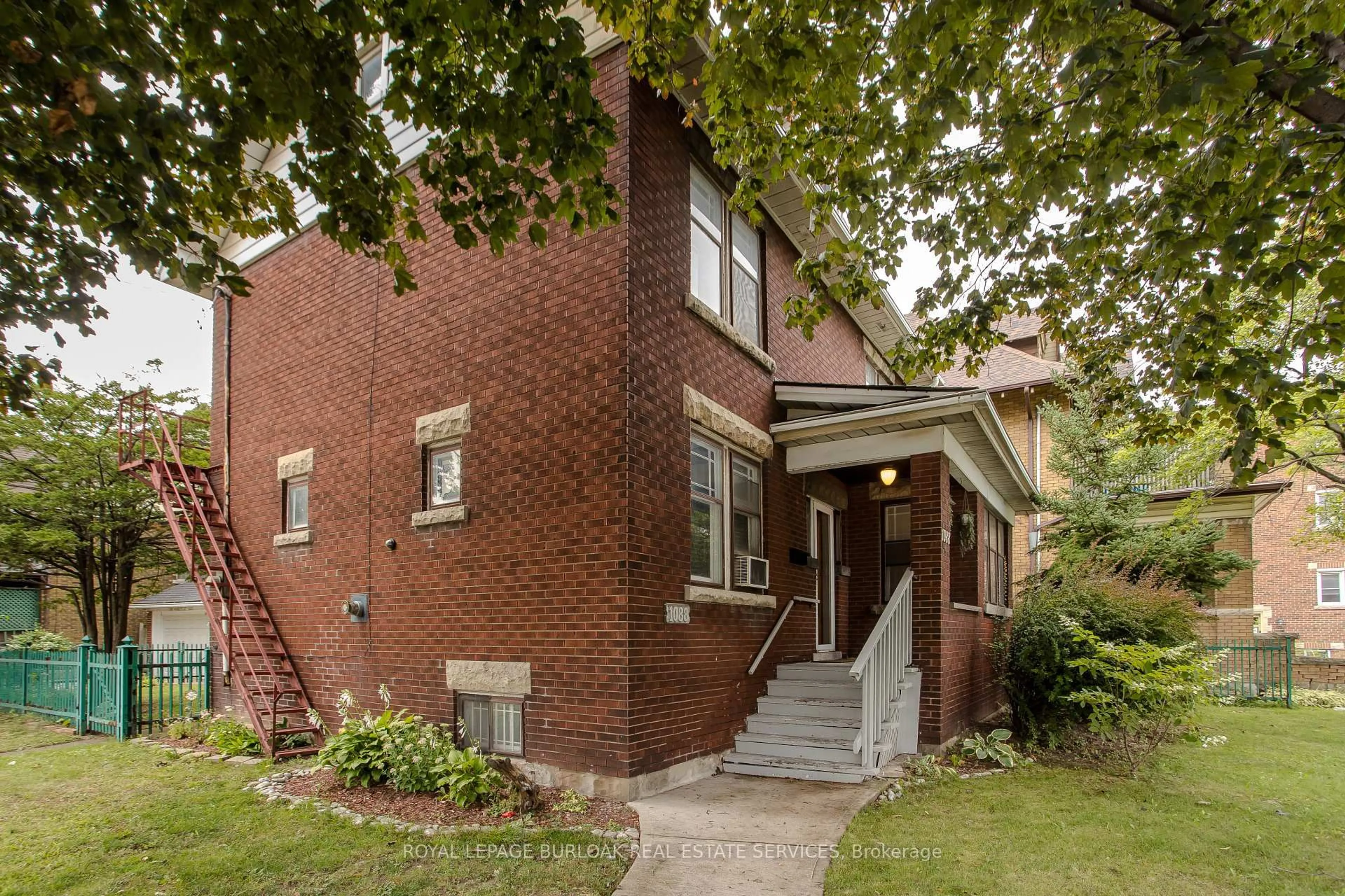 Home with brick exterior material, street for 1088 King St, Hamilton Ontario L8M 1E3
