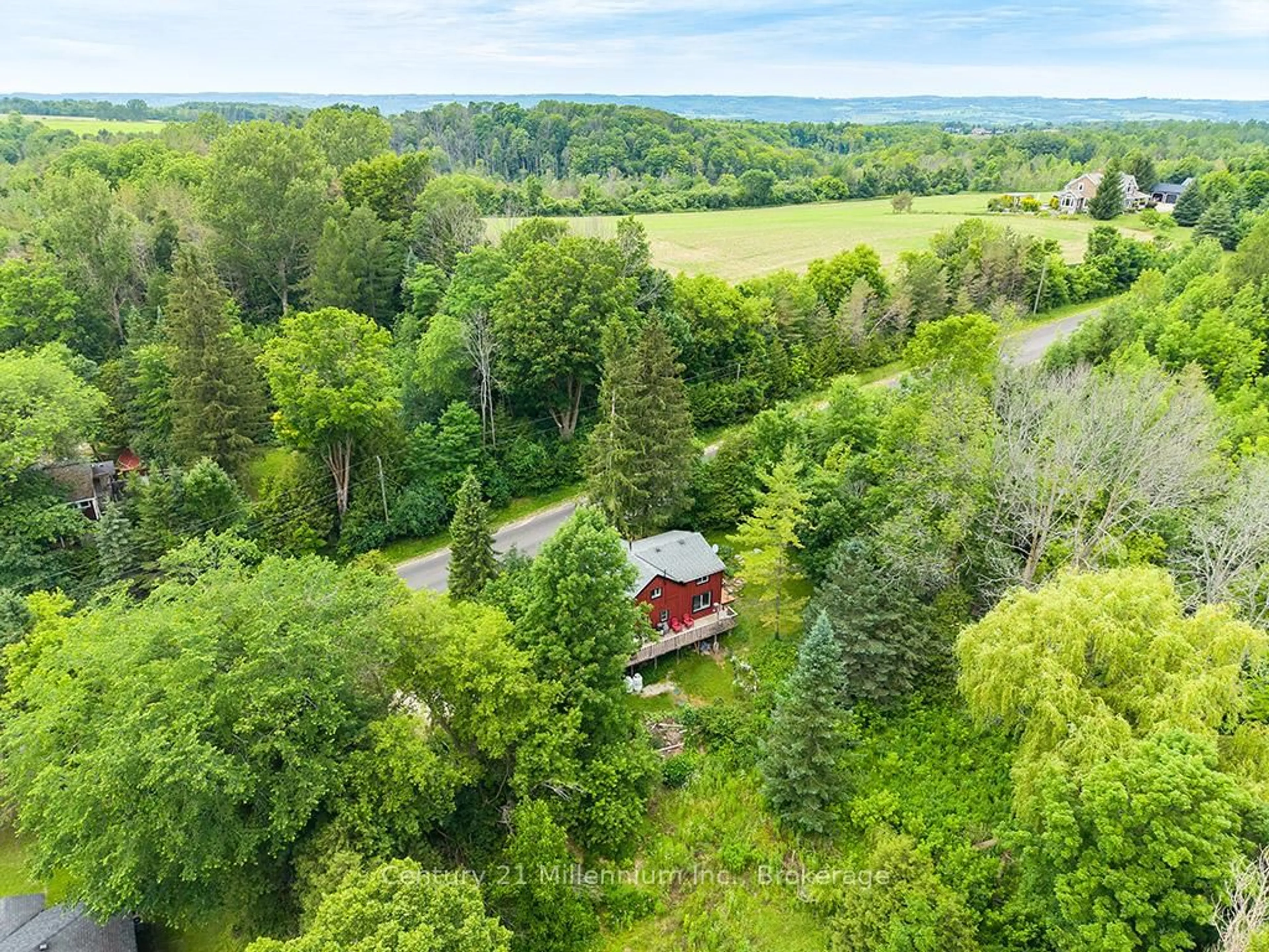 A pic from outside/outdoor area/front of a property/back of a property/a pic from drone, forest/trees view for 415877 Tenth Line, Blue Mountains Ontario N0H 1J0