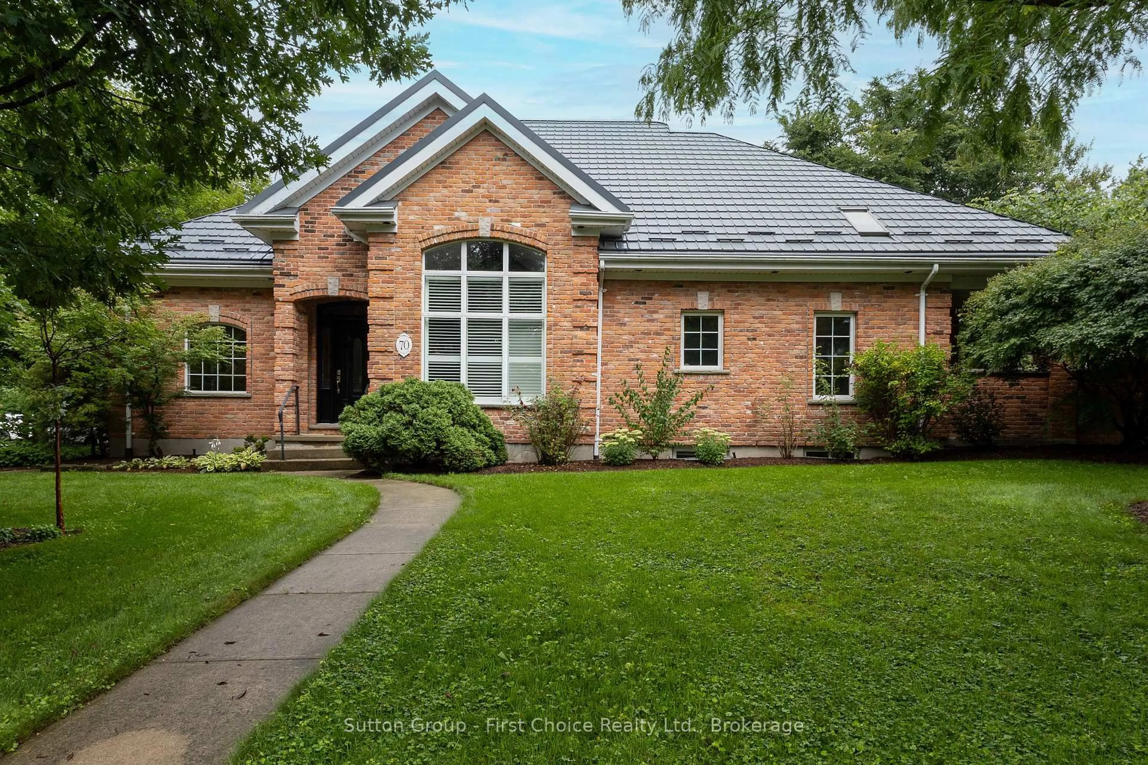 Home with brick exterior material, street for 70 Crawford St, Stratford Ontario N5A 5Y4