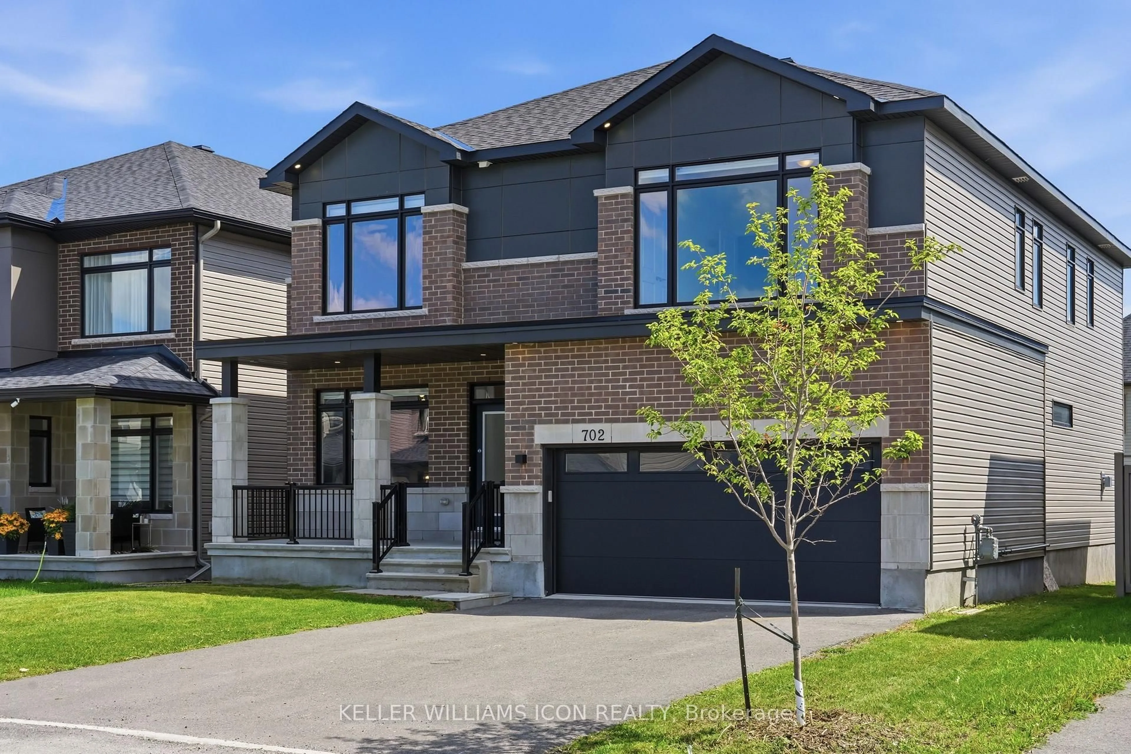 Home with brick exterior material, street for 702 ROSALES Rdge, Ottawa Ontario K1T 0V5