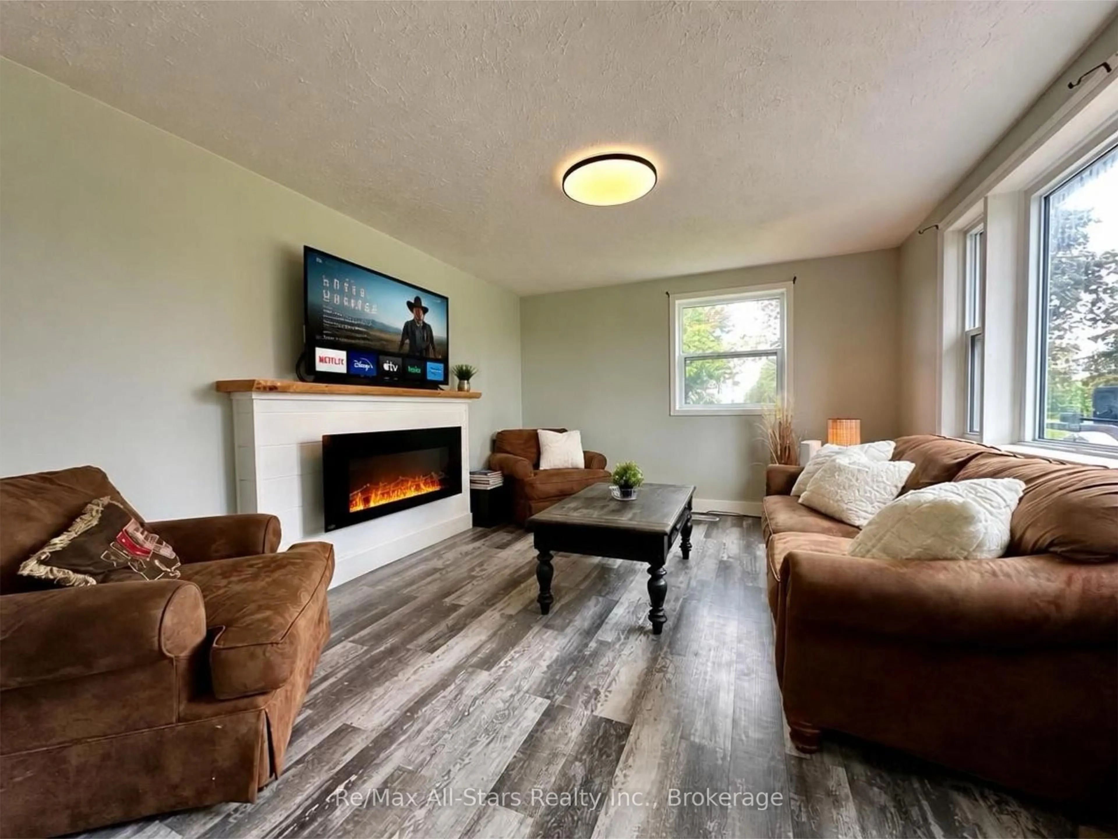 Living room with furniture, wood/laminate floor for 815 County Road 8 Rd, Kawartha Lakes Ontario K0M 1N0