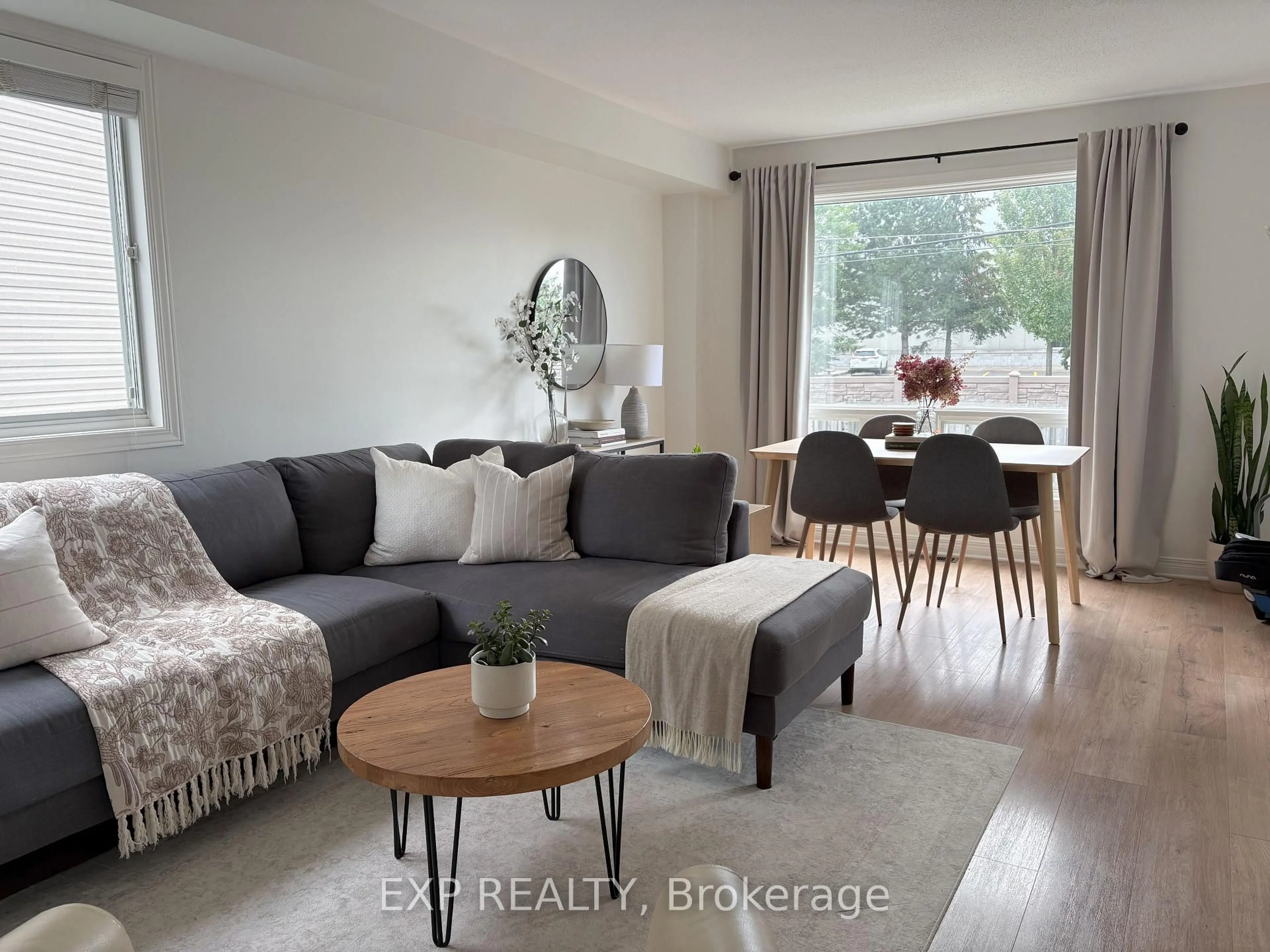 Living room with furniture, wood/laminate floor for 16 Crampton Dr, Carleton Place Ontario K7C 4P7
