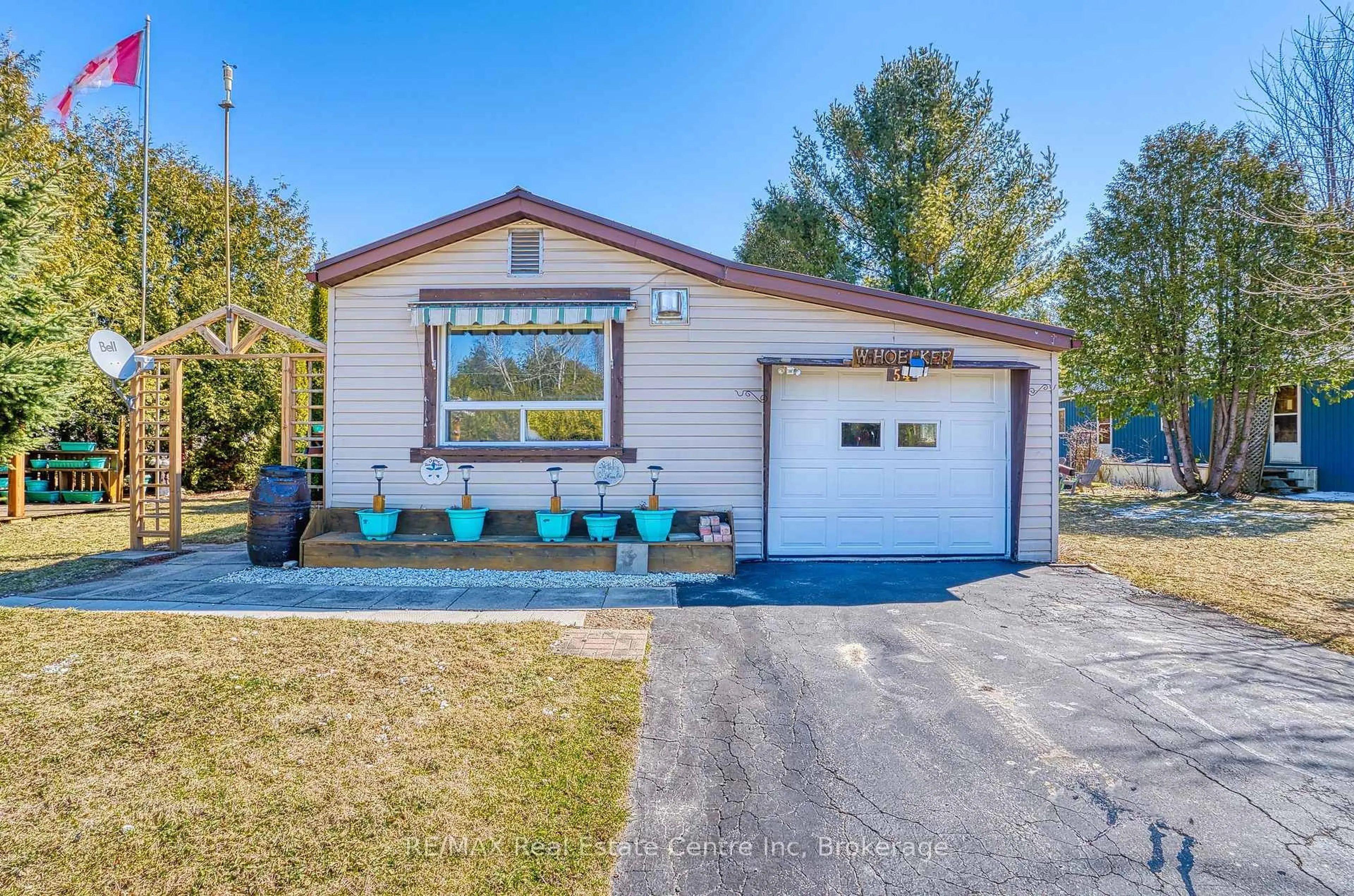 Home with vinyl exterior material, street for 54 First Ave, Wellington North Ontario N0G 1A0