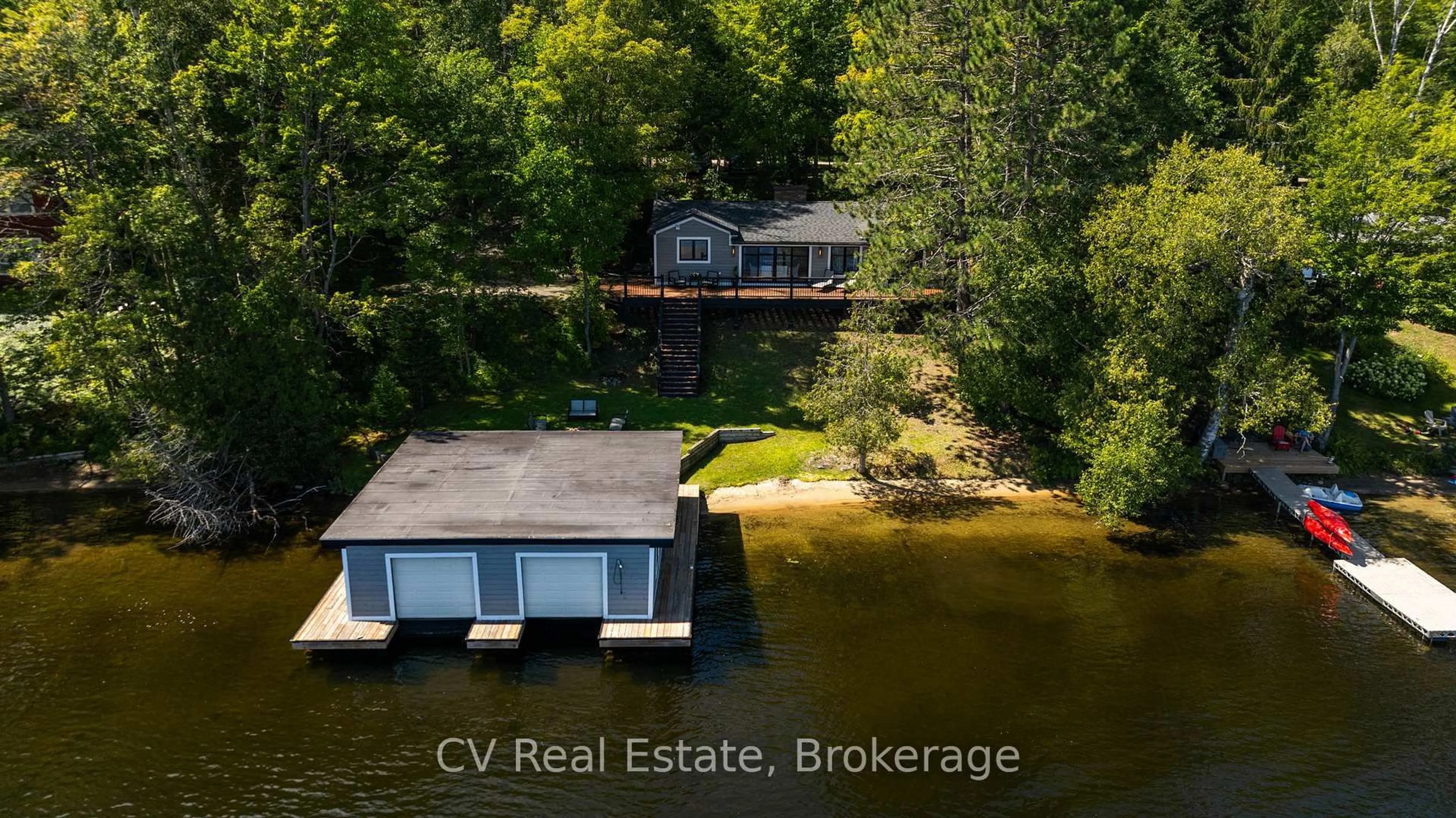A pic from outside/outdoor area/front of a property/back of a property/a pic from drone, water/lake/river/ocean view for 1017 White Pine Rd, Lake of Bays Ontario P1H 2J6