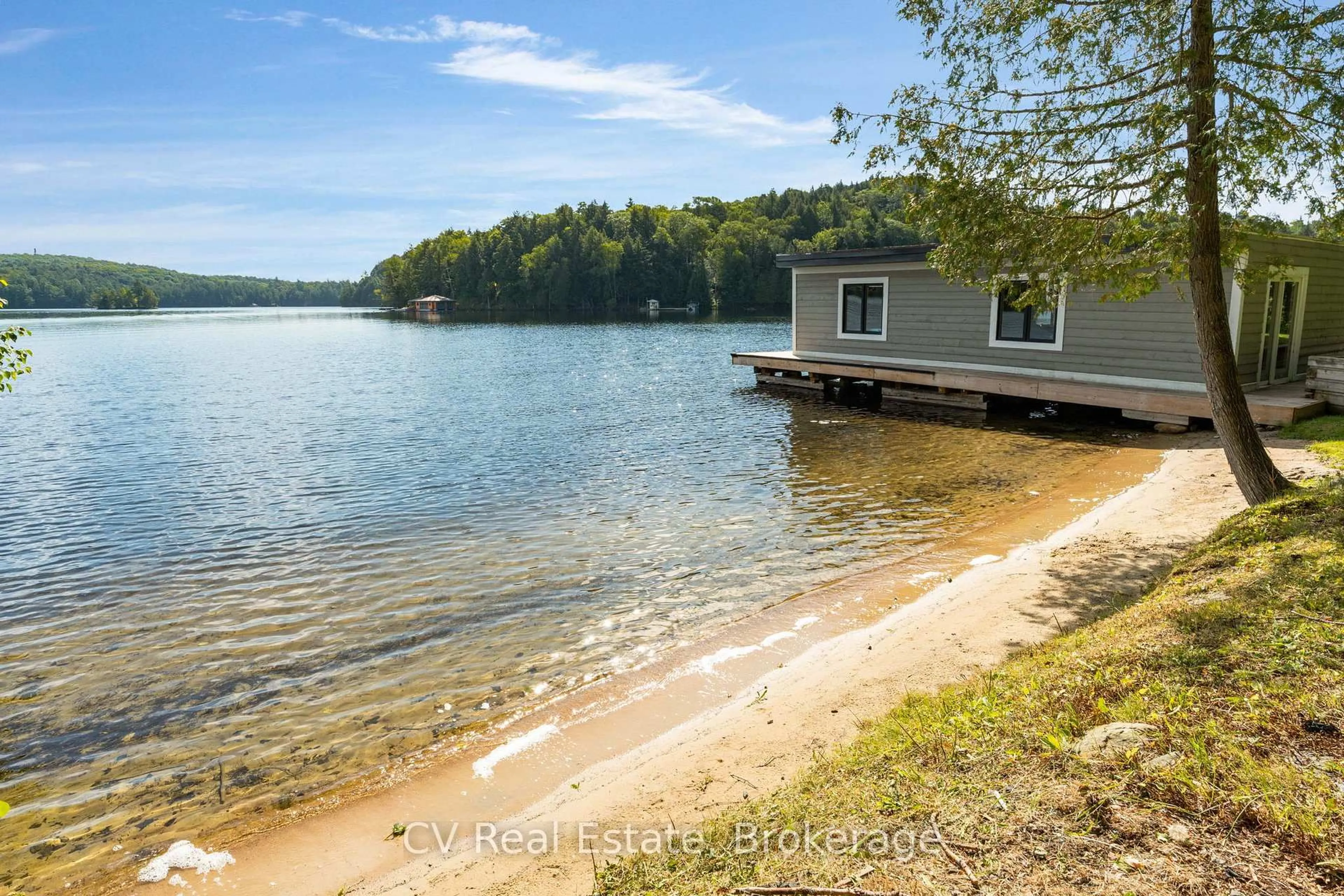 A pic from outside/outdoor area/front of a property/back of a property/a pic from drone, water/lake/river/ocean view for 1017 White Pine Rd, Lake of Bays Ontario P1H 2J6