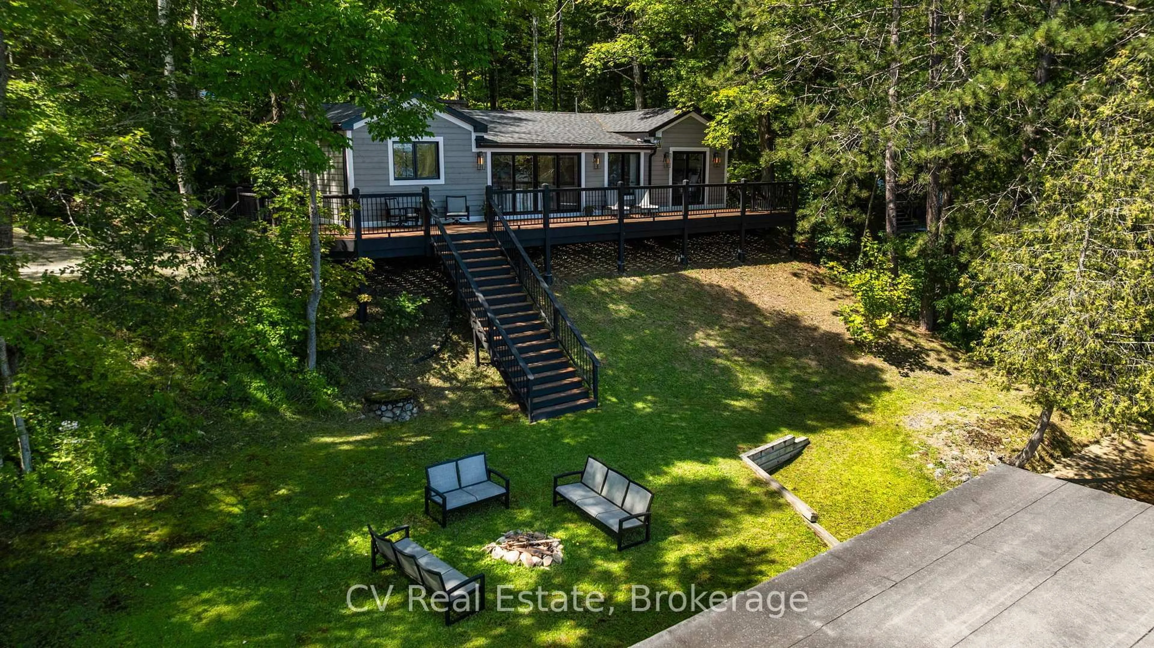A pic from outside/outdoor area/front of a property/back of a property/a pic from drone, water/lake/river/ocean view for 1017 White Pine Rd, Lake of Bays Ontario P1H 2J6