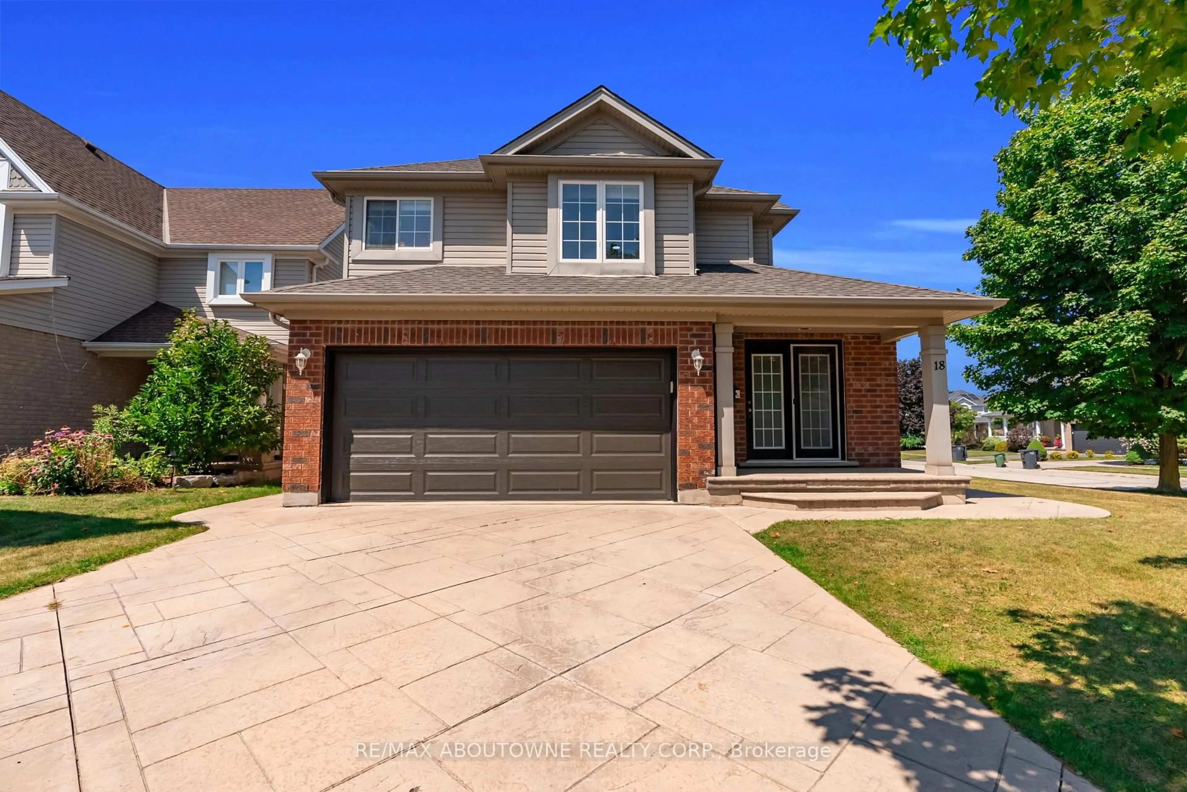 Home with brick exterior material, street for 18 Haney Dr, Guelph Ontario N1L 1N7