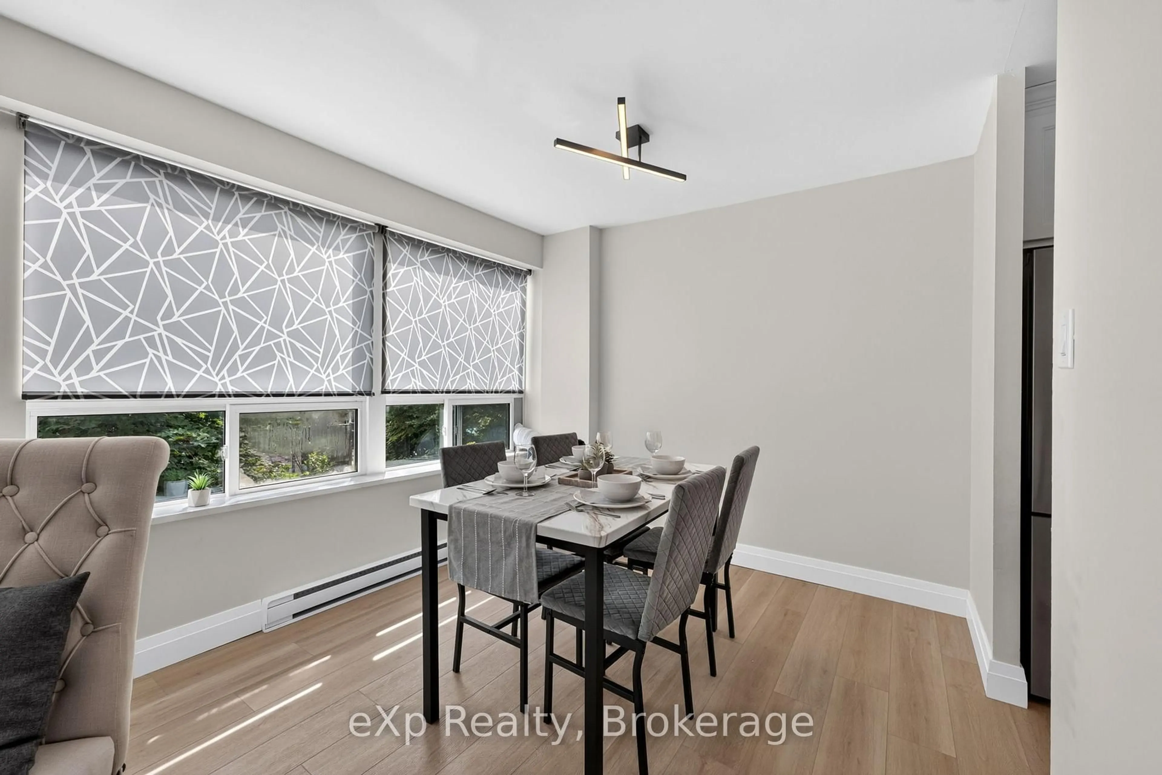 Dining room, wood/laminate floor for 1447 Huron St #220, London East Ontario N5V 2E6