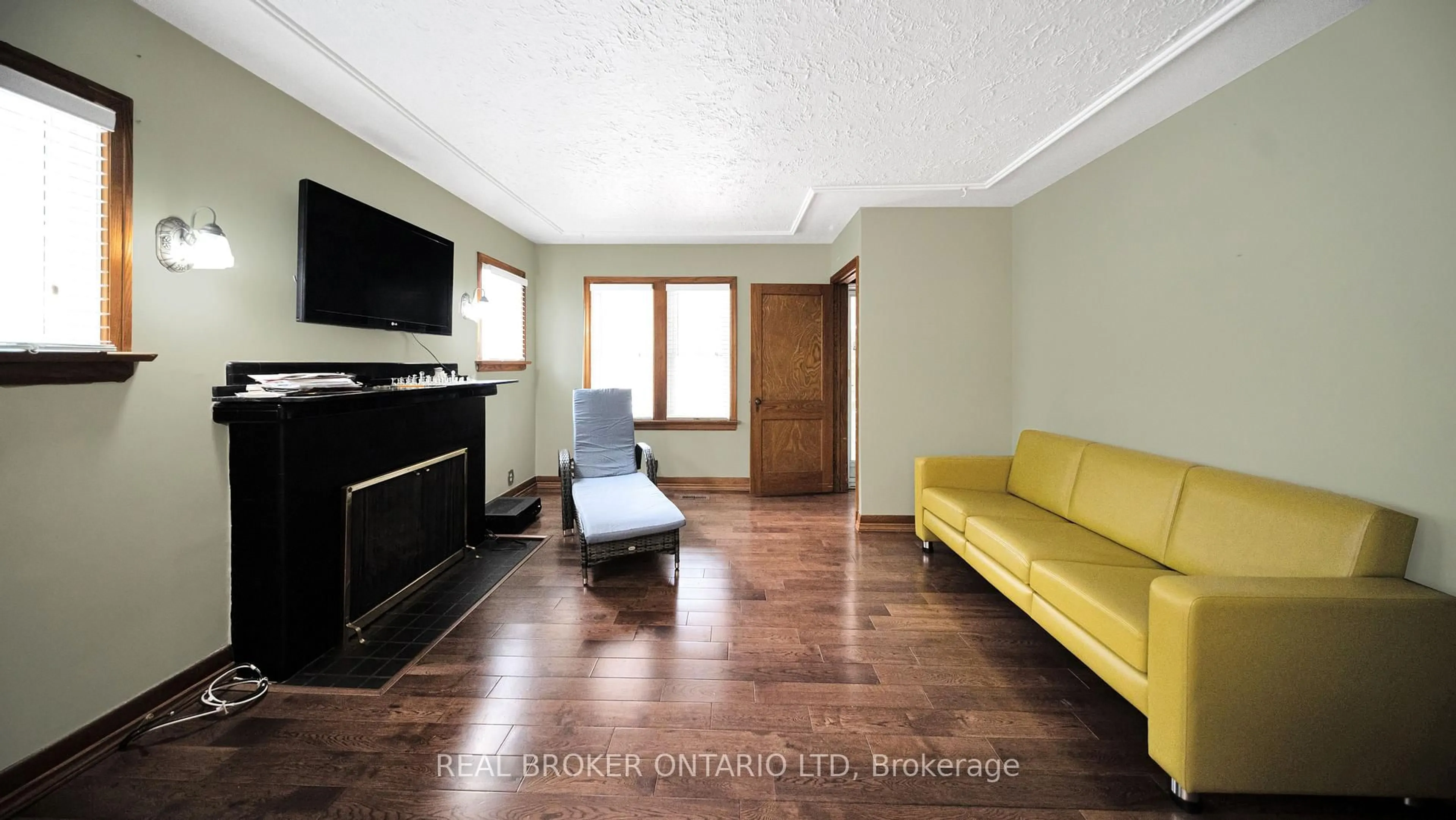 Living room with furniture, wood/laminate floor for 74 Sterling St, London East Ontario N5Y 1Y7