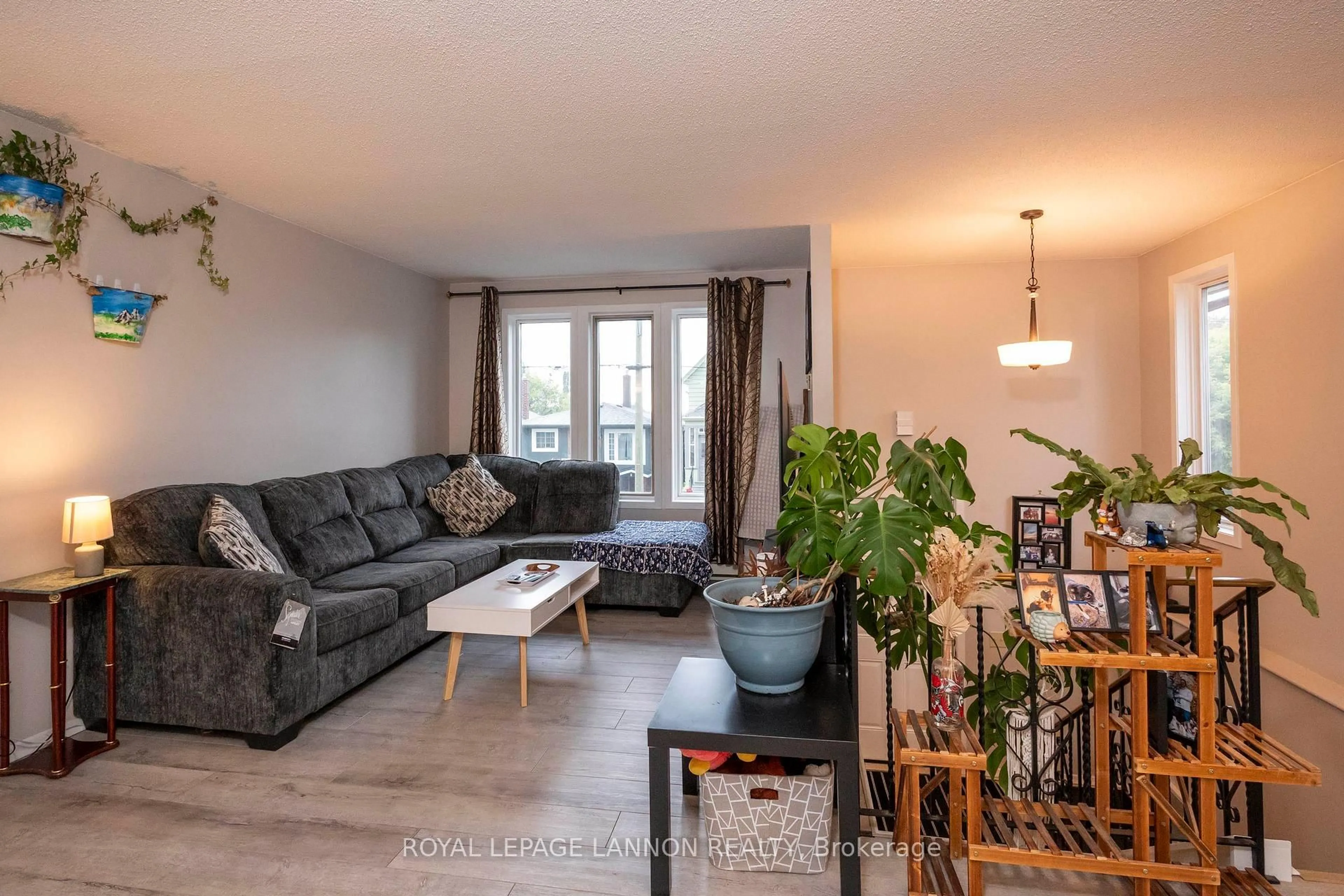 Living room with furniture, wood/laminate floor for 80 Peter St, Thunder Bay Ontario P7A 5H3