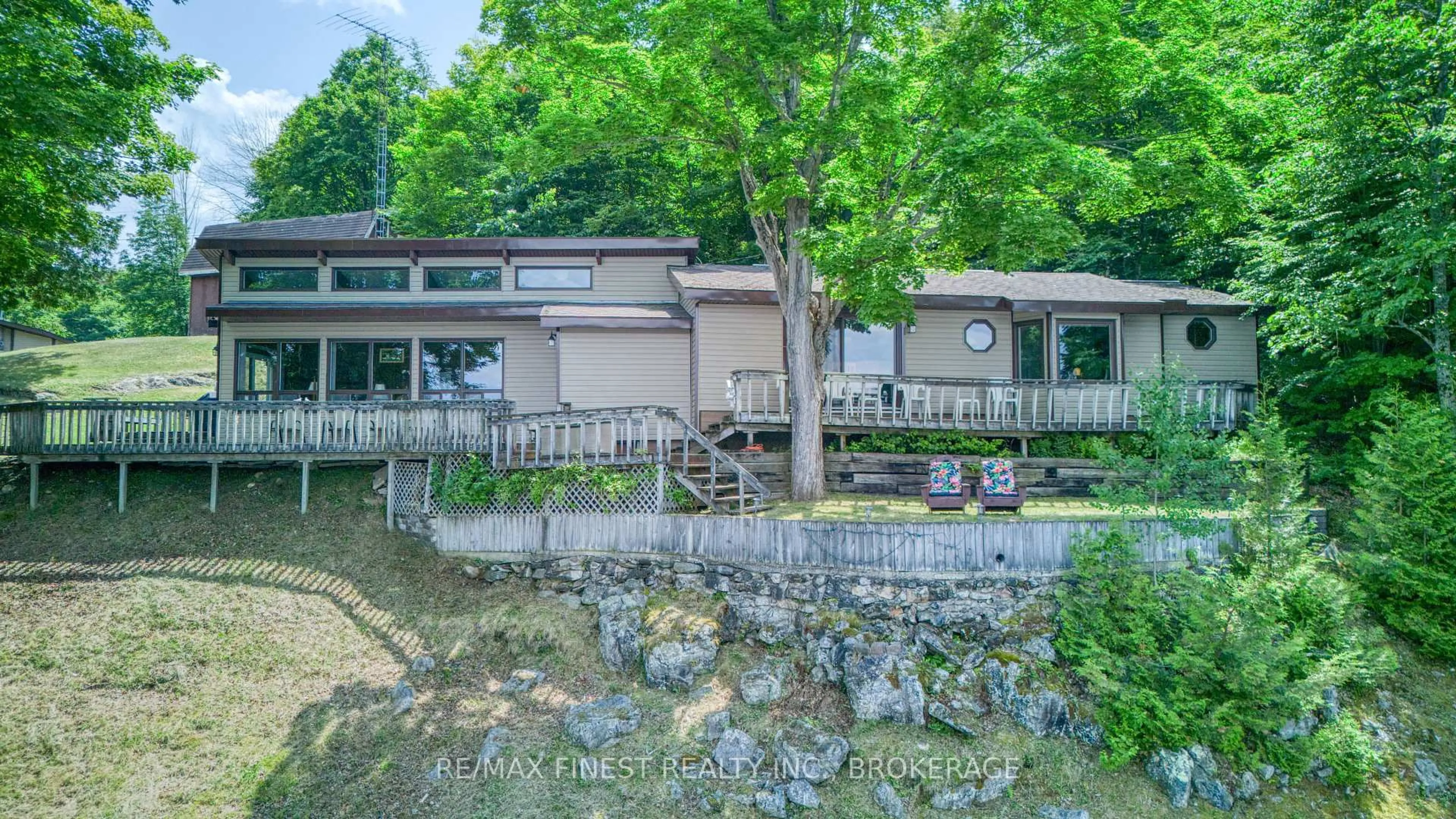 A pic from outside/outdoor area/front of a property/back of a property/a pic from drone, water/lake/river/ocean view for 1182B Johnston Lane, Arden Ontario K0H 1B0