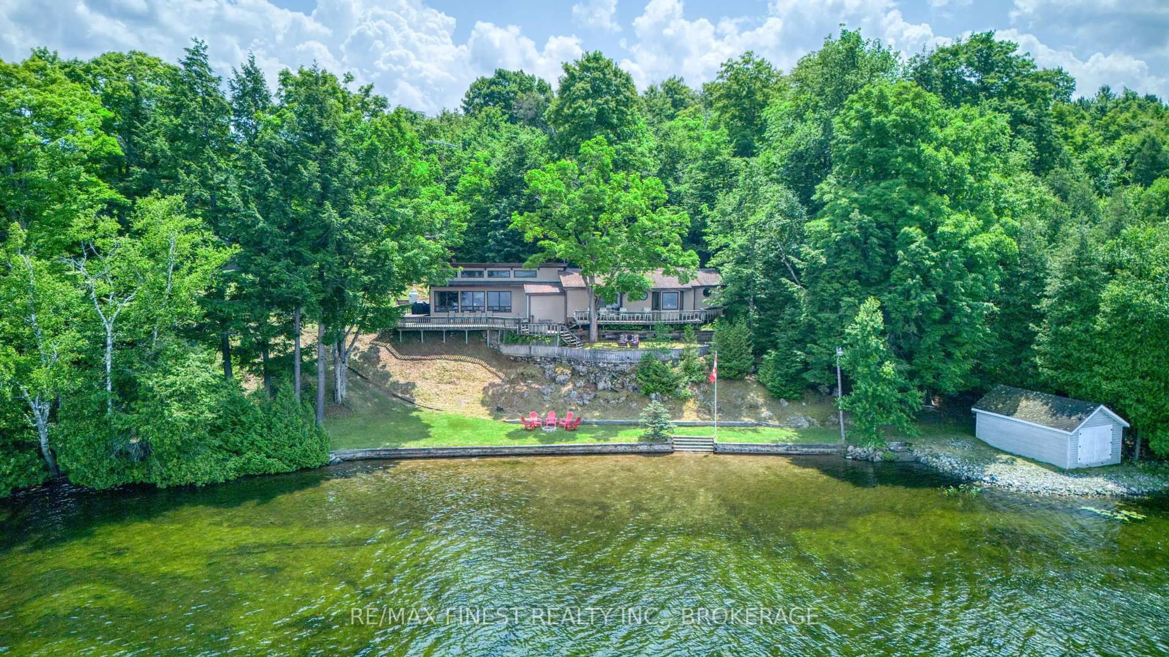 A pic from outside/outdoor area/front of a property/back of a property/a pic from drone, water/lake/river/ocean view for 1182B Johnston Lane, Arden Ontario K0H 1B0