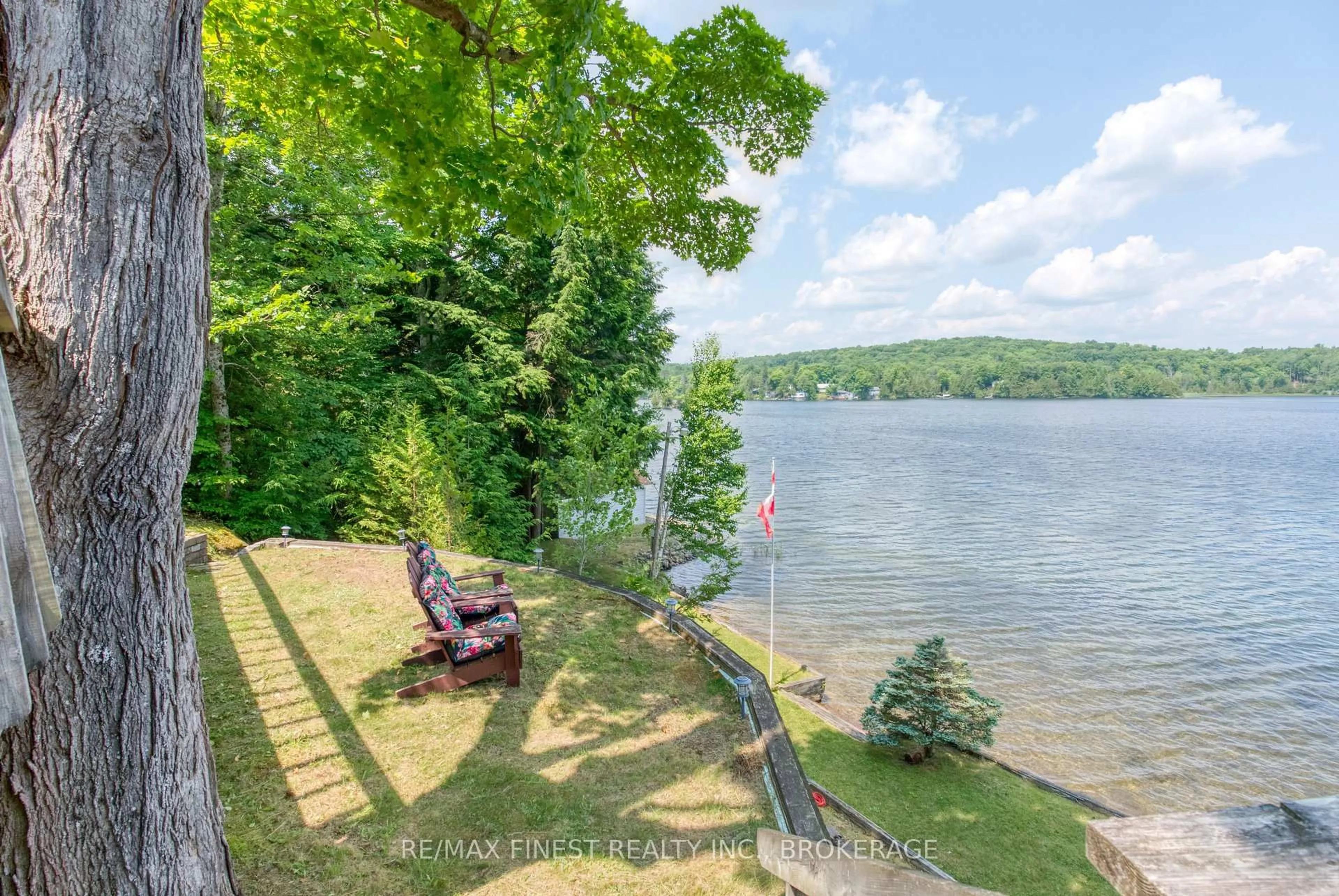 A pic from outside/outdoor area/front of a property/back of a property/a pic from drone, water/lake/river/ocean view for 1182B Johnston Lane, Arden Ontario K0H 1B0