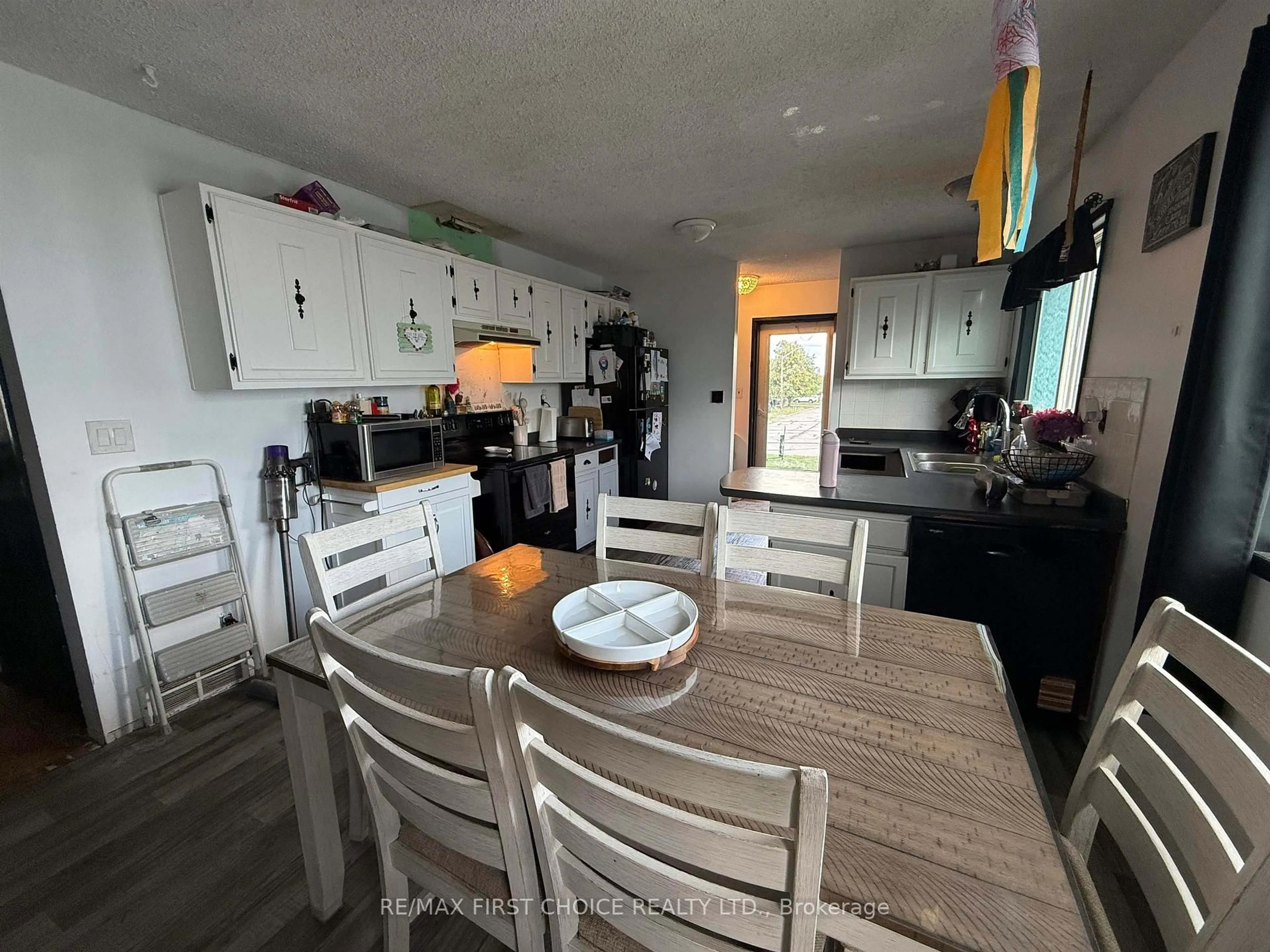 Open concept kitchen, wood/laminate floor for 24 Elvis Ave, Dryden Ontario P8N 3A3