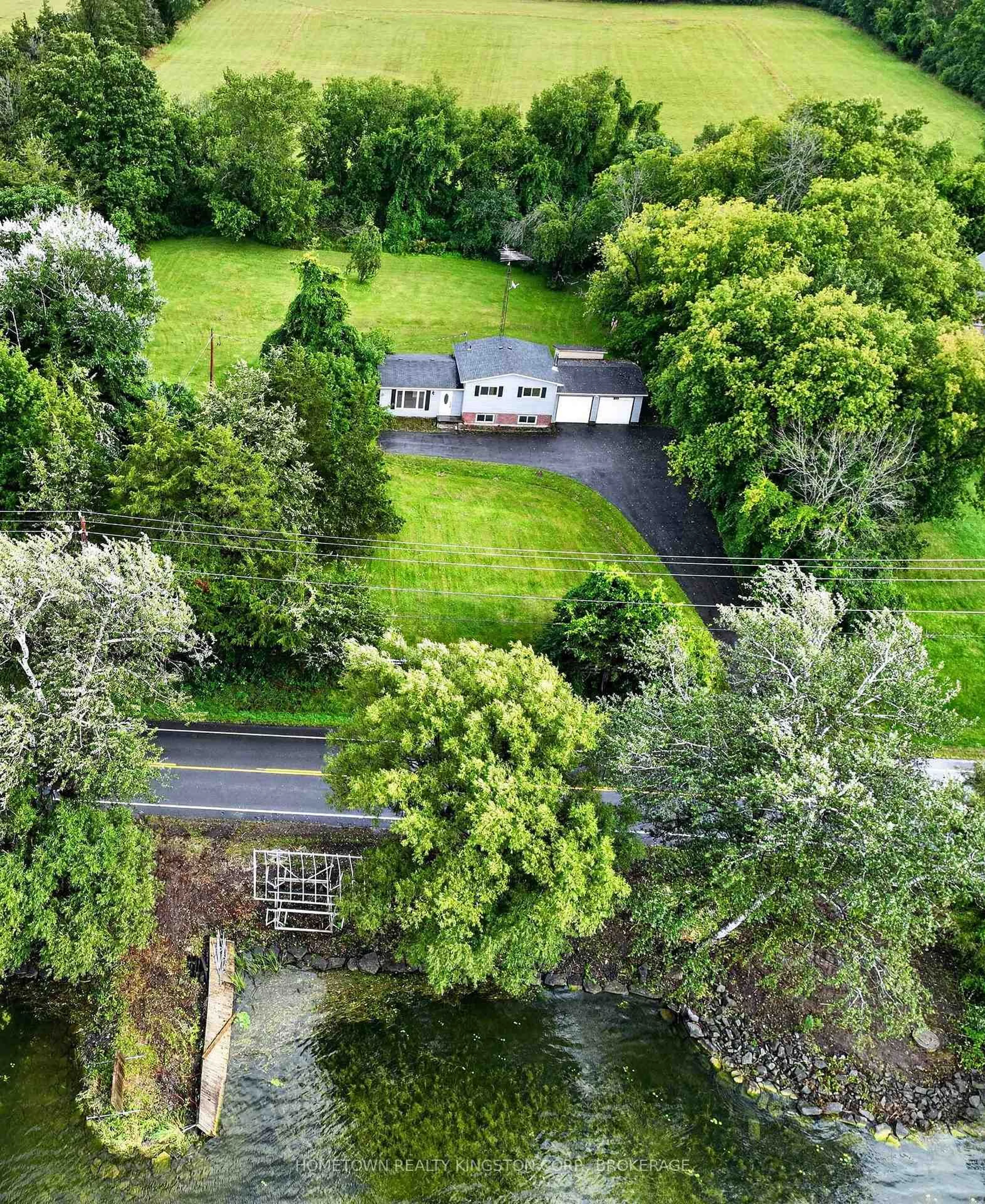 A pic from outside/outdoor area/front of a property/back of a property/a pic from drone, forest/trees view for 1024 South Shore Rd, Napanee Ontario K7R 3K7