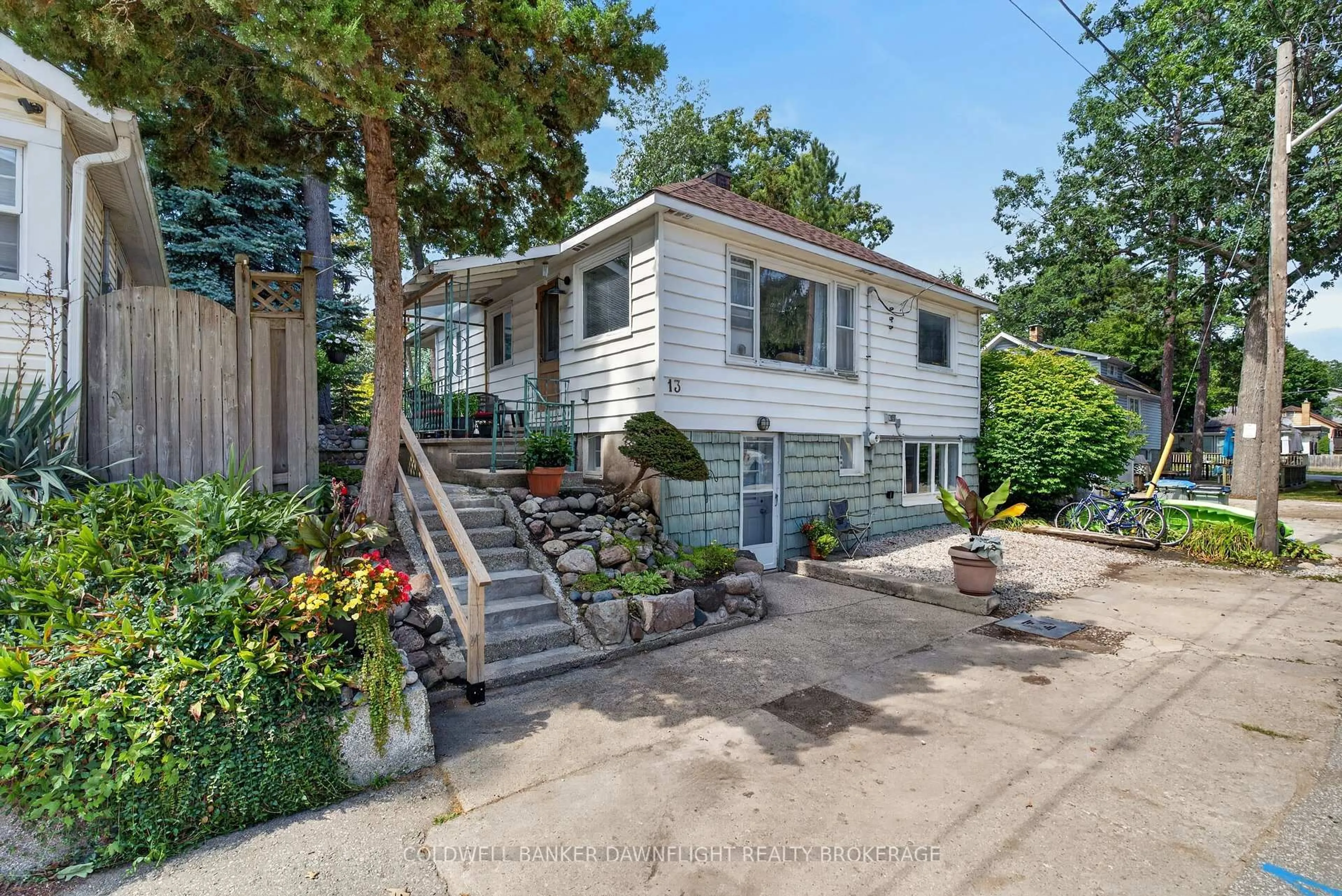 Home with vinyl exterior material, street for 13 Warwick Ave, Lambton Shores Ontario N0M 1T0