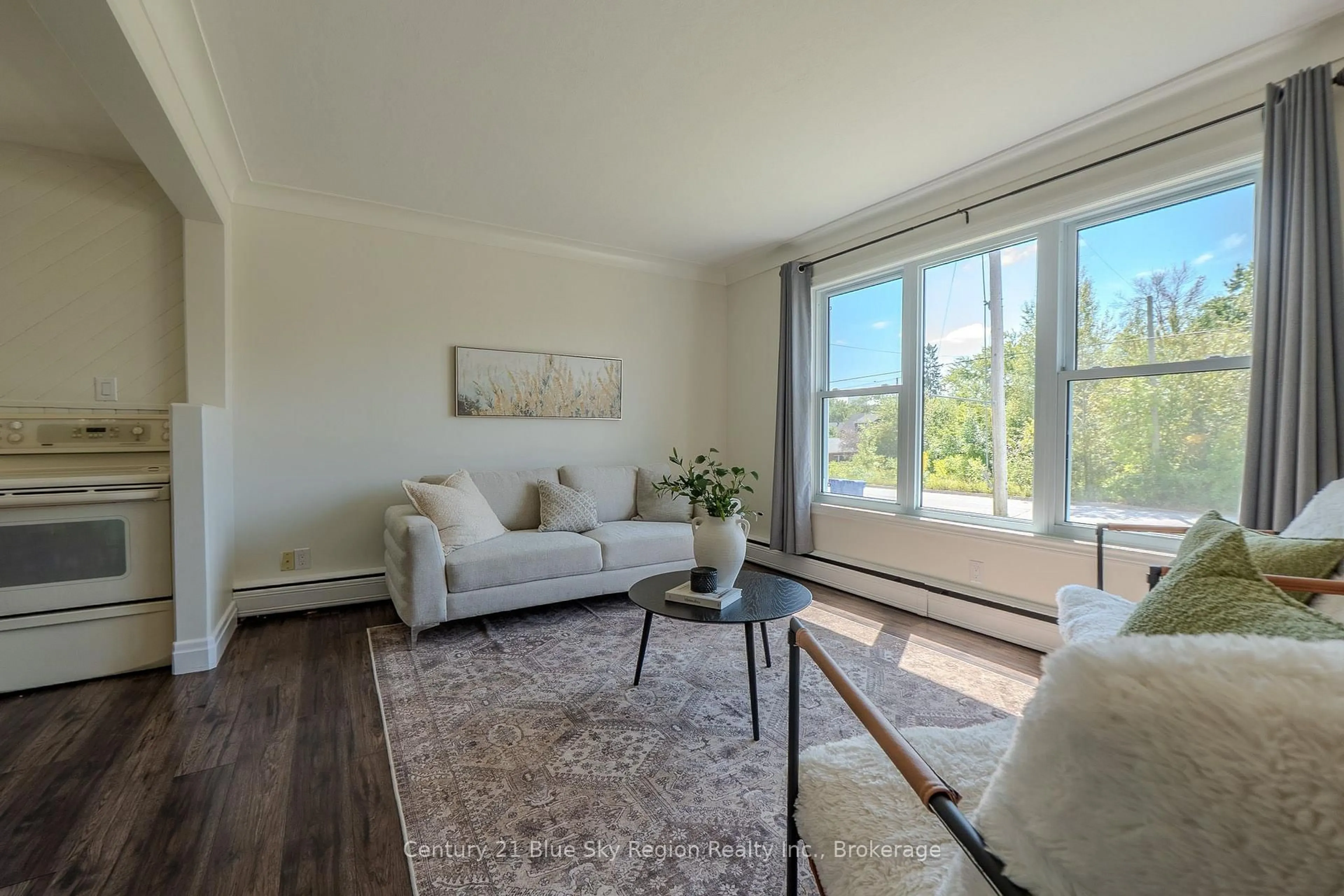 Living room with furniture, wood/laminate floor for 918 COPELAND St, North Bay Ontario P1B 3E4