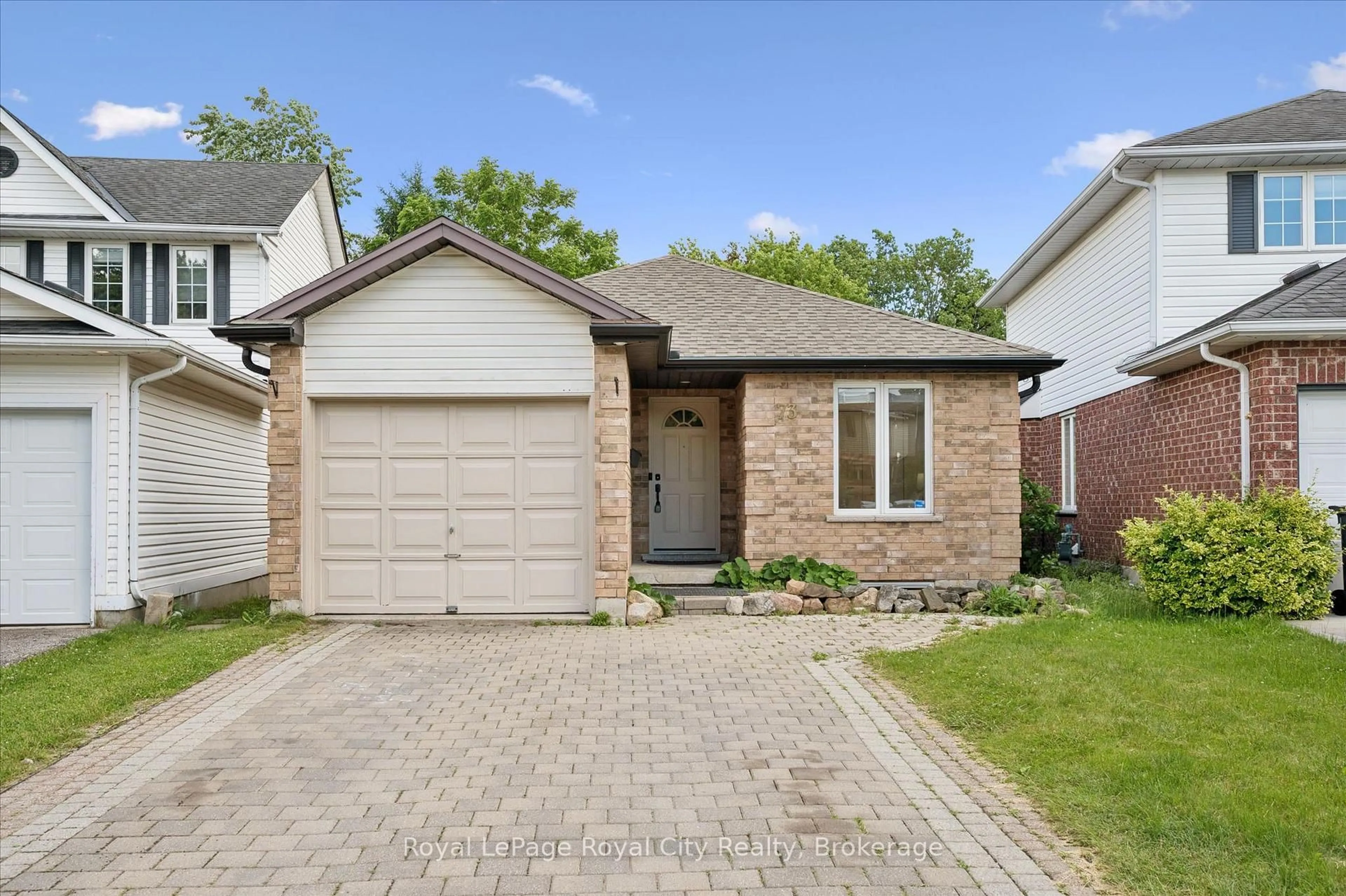 Home with brick exterior material, street for 73 Waxwing Cres, Guelph Ontario N1C 1E3