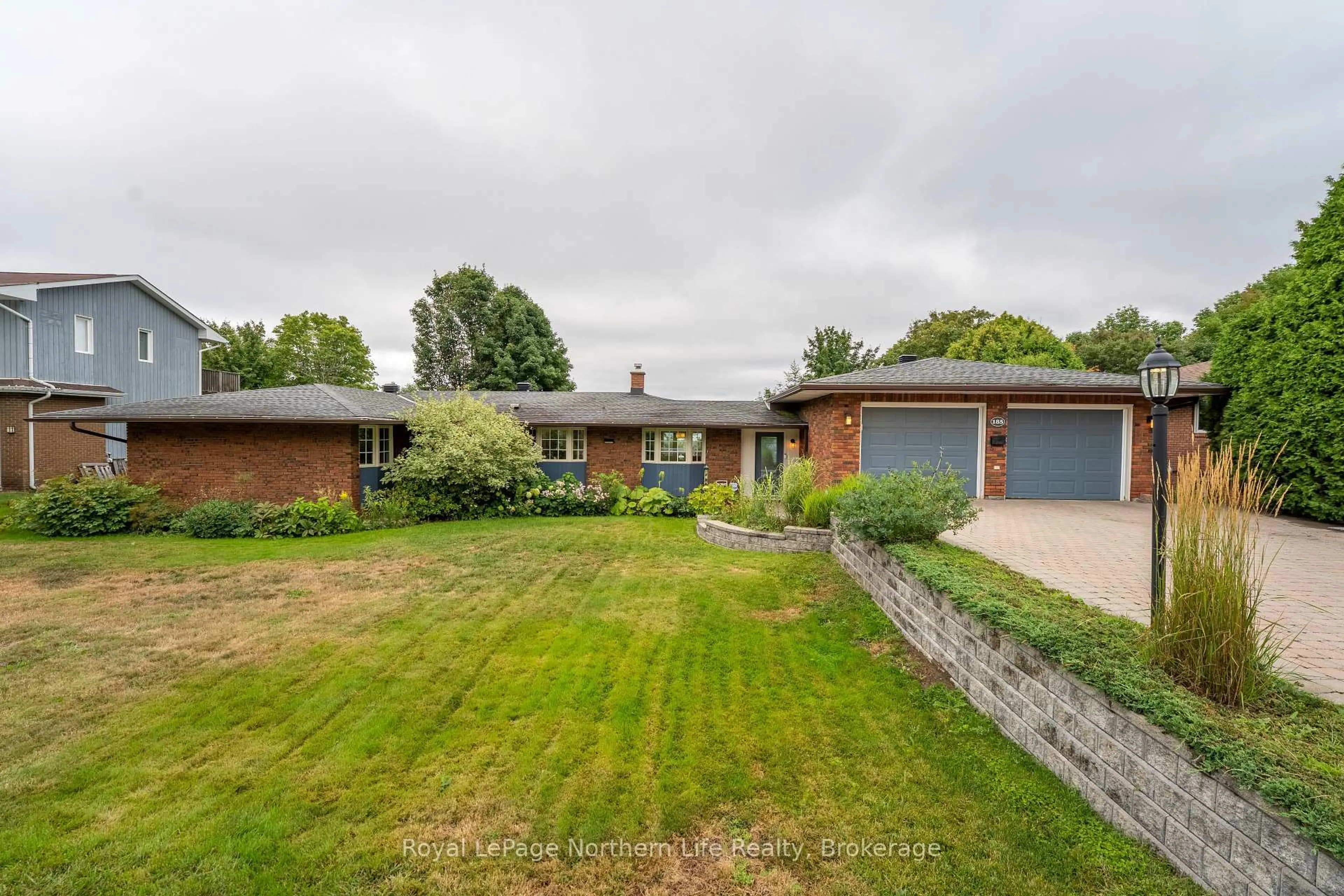 A pic from outside/outdoor area/front of a property/back of a property/a pic from drone, street for 185 Wallace Heights Dr, North Bay Ontario P1C 1E7