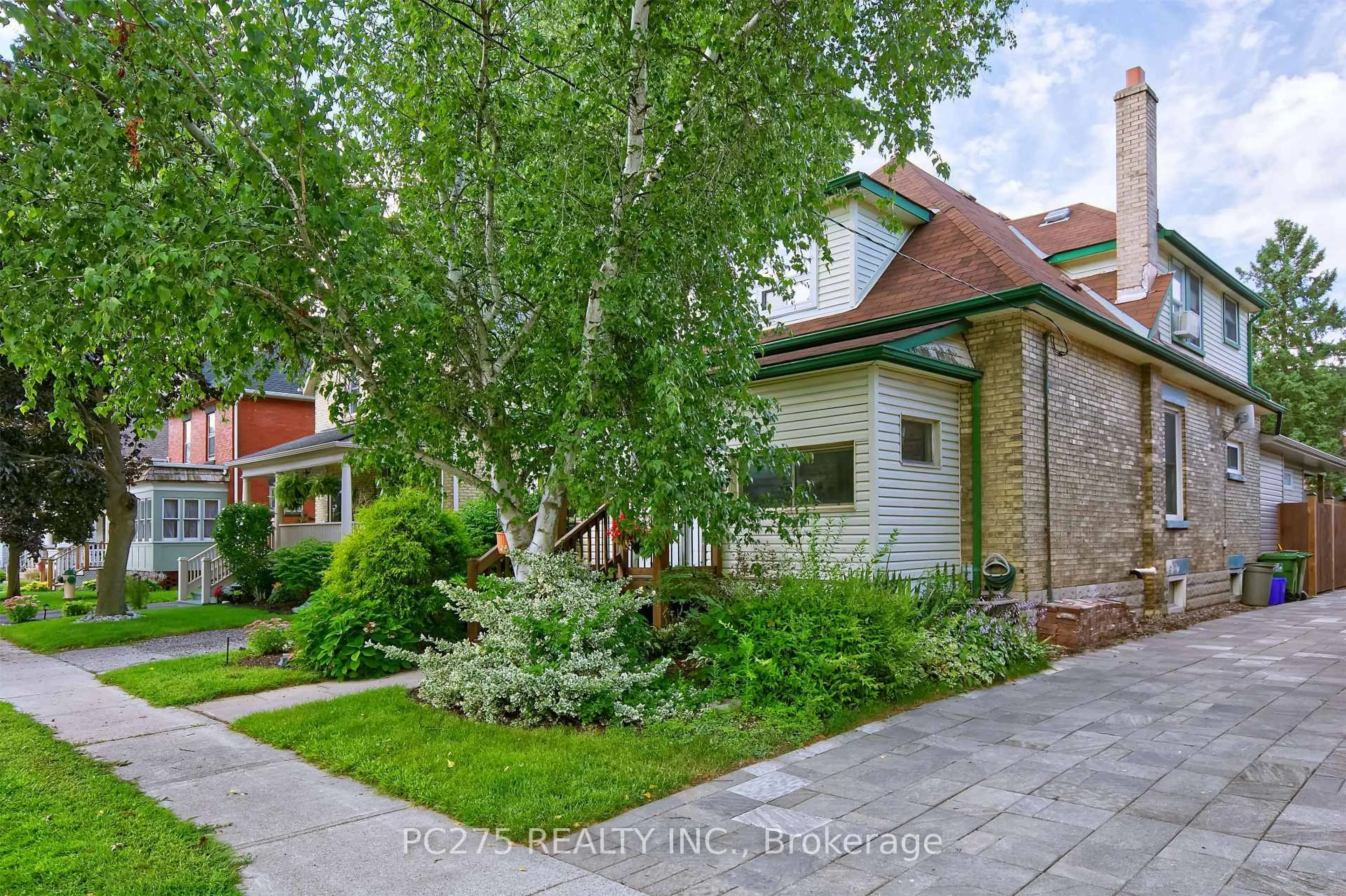 Home with brick exterior material, street for 20 Maple St, St. Thomas Ontario N5R 1Y9