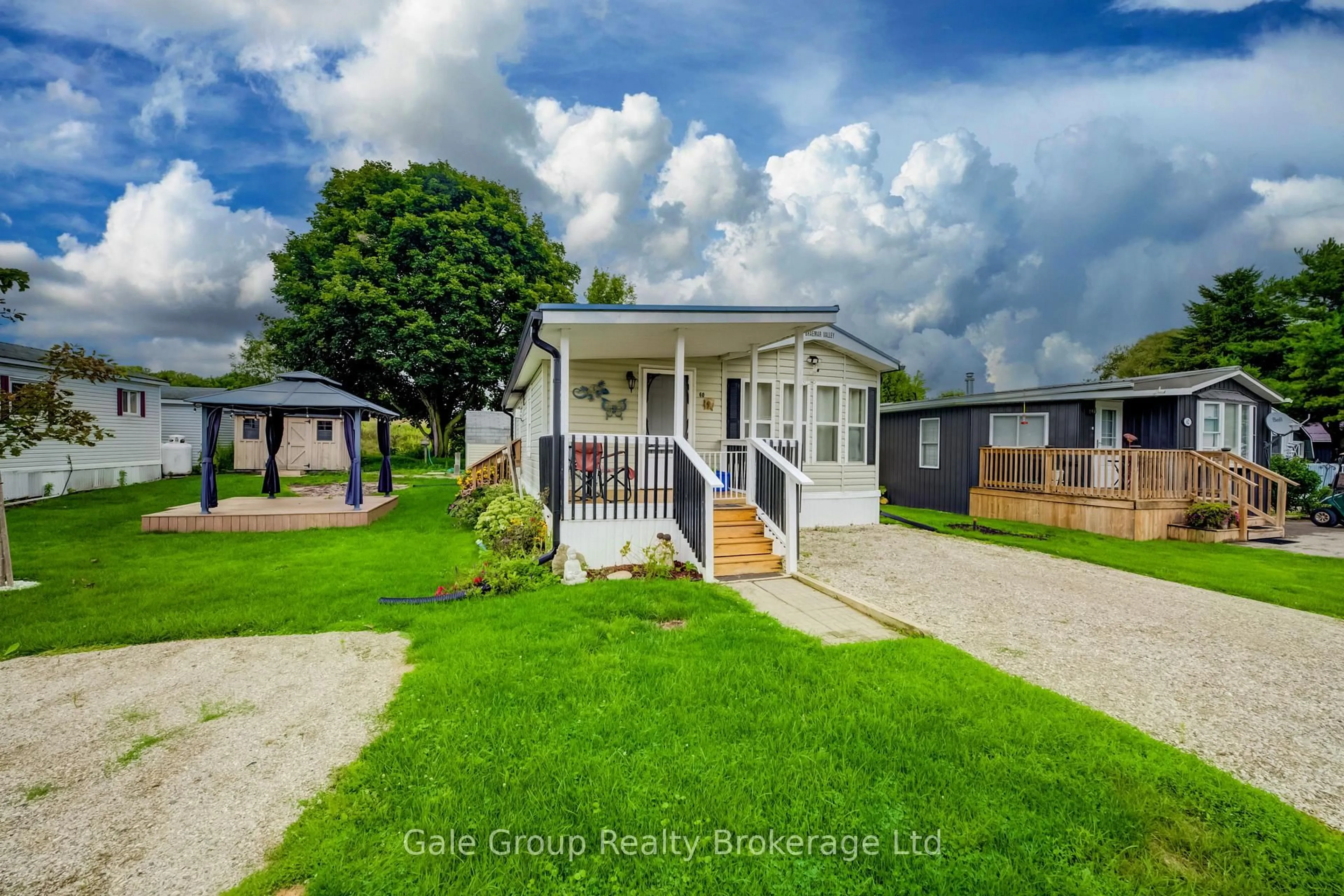 A pic from outside/outdoor area/front of a property/back of a property/a pic from drone, street for 495856 10th Line #60, East Zorra-Tavistock Ontario N4S 7V7