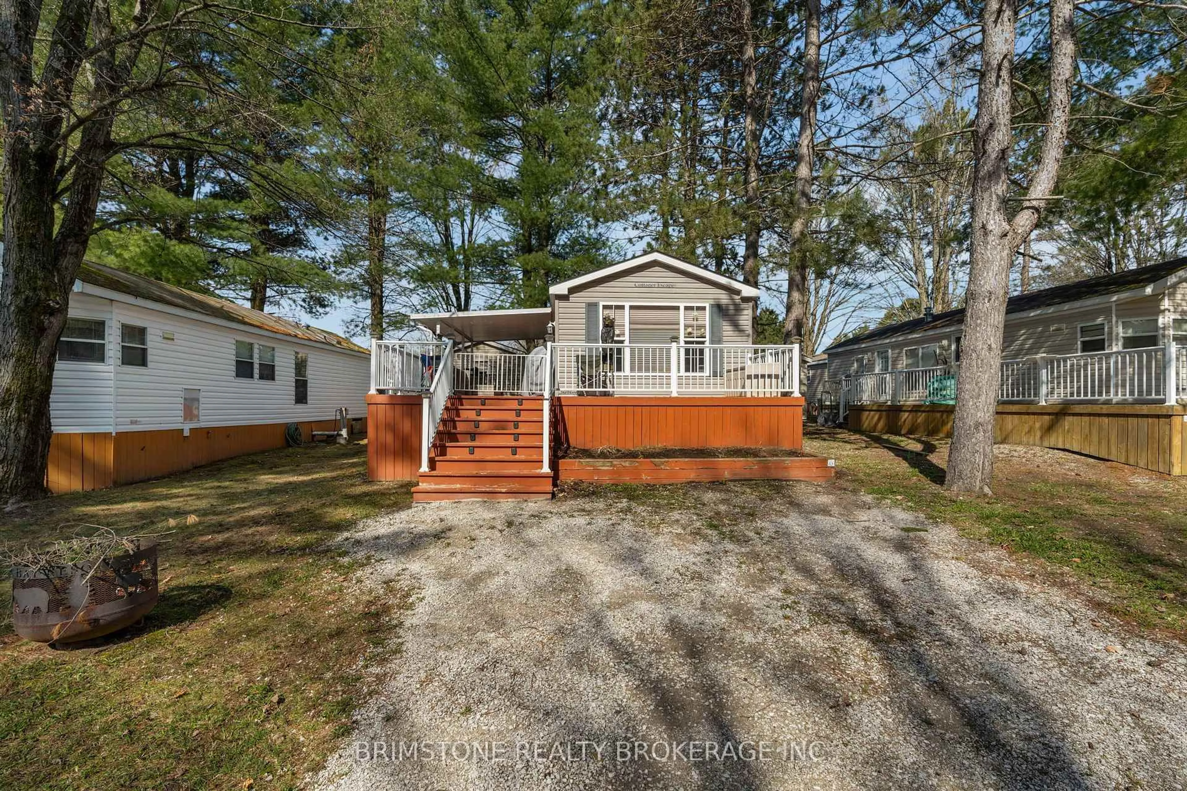 A pic from outside/outdoor area/front of a property/back of a property/a pic from drone, water/lake/river/ocean view for 1082 Shamrock Marina Rd #63, Gravenhurst Ontario P0E 1N0