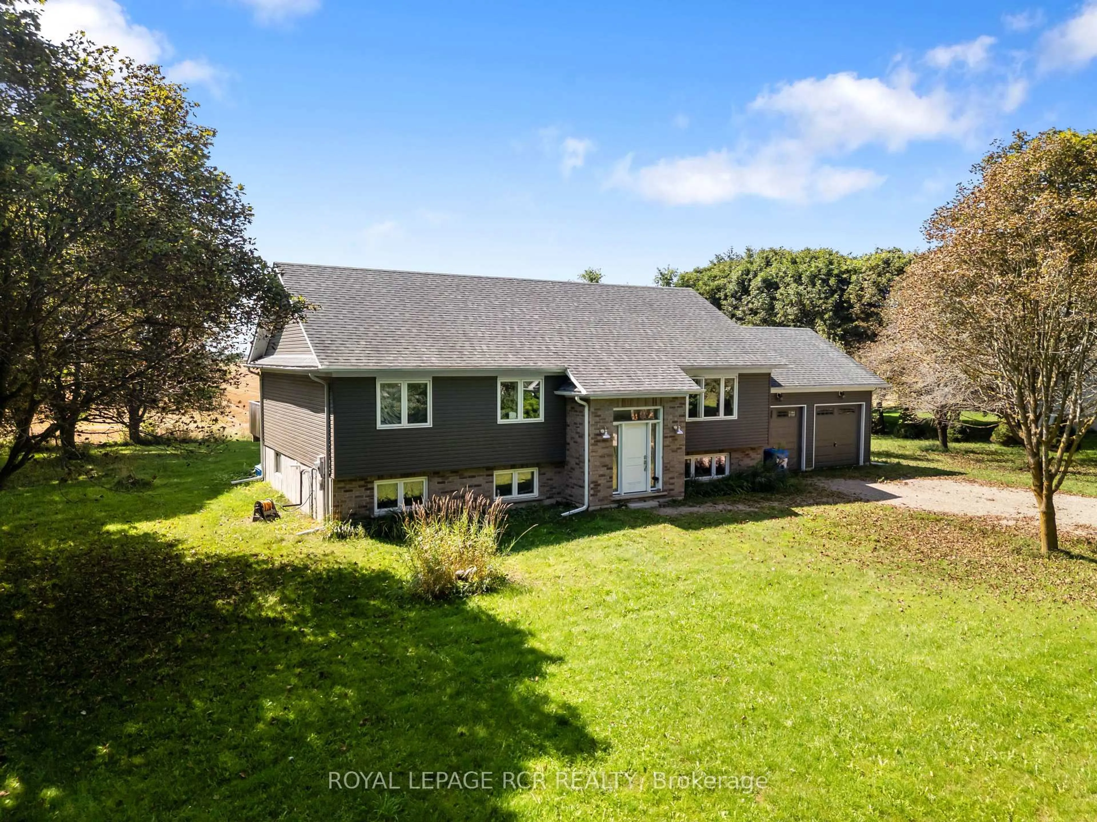 A pic from outside/outdoor area/front of a property/back of a property/a pic from drone, water/lake/river/ocean view for 402202 County Road 15, East Luther Grand Valley Ontario L9W 0Z4
