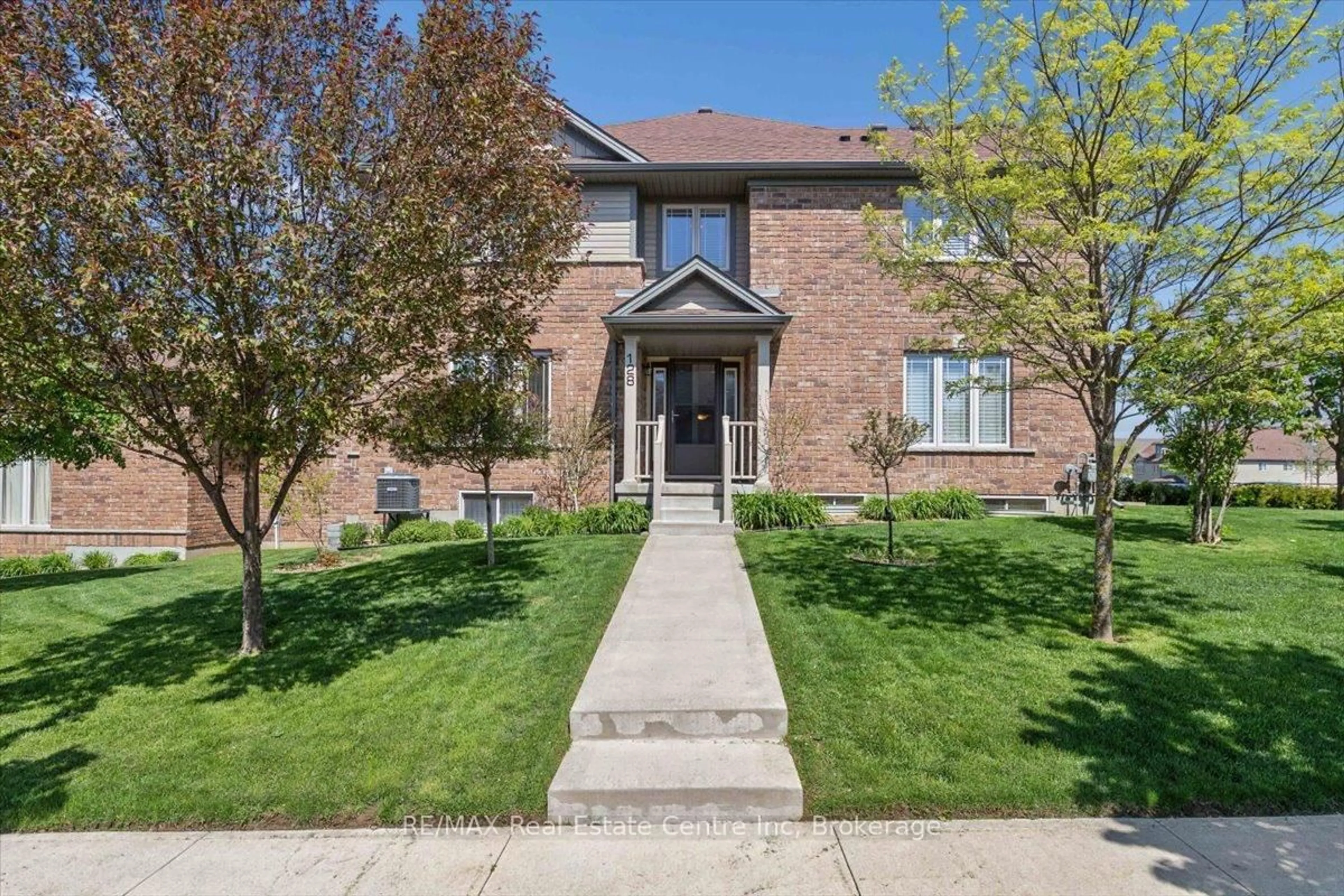 Home with brick exterior material, street for 128 Ingram Dr, Guelph Ontario N1E 0M6