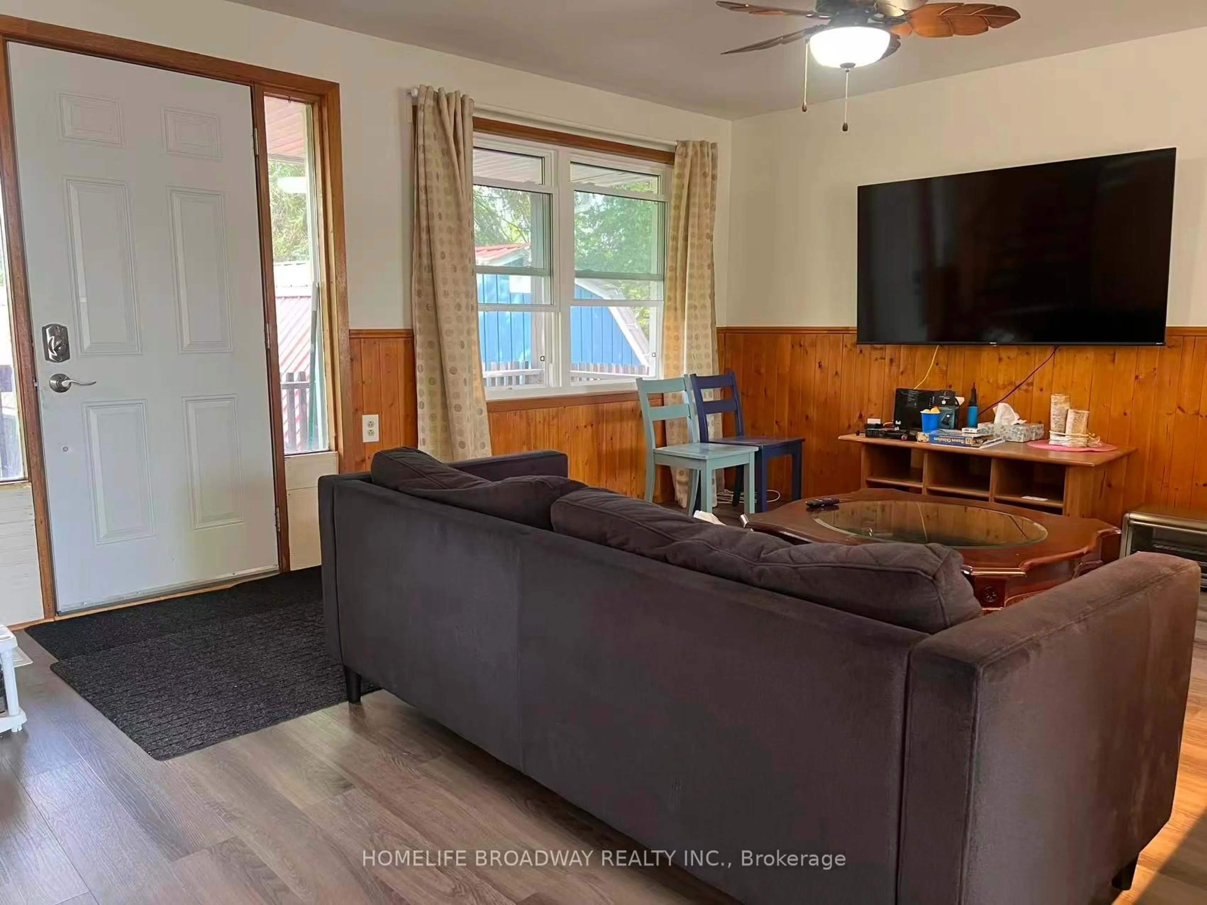 Living room with furniture, wood/laminate floor for 1389 Portage Rd, Kawartha Lakes Ontario K0M 2B0