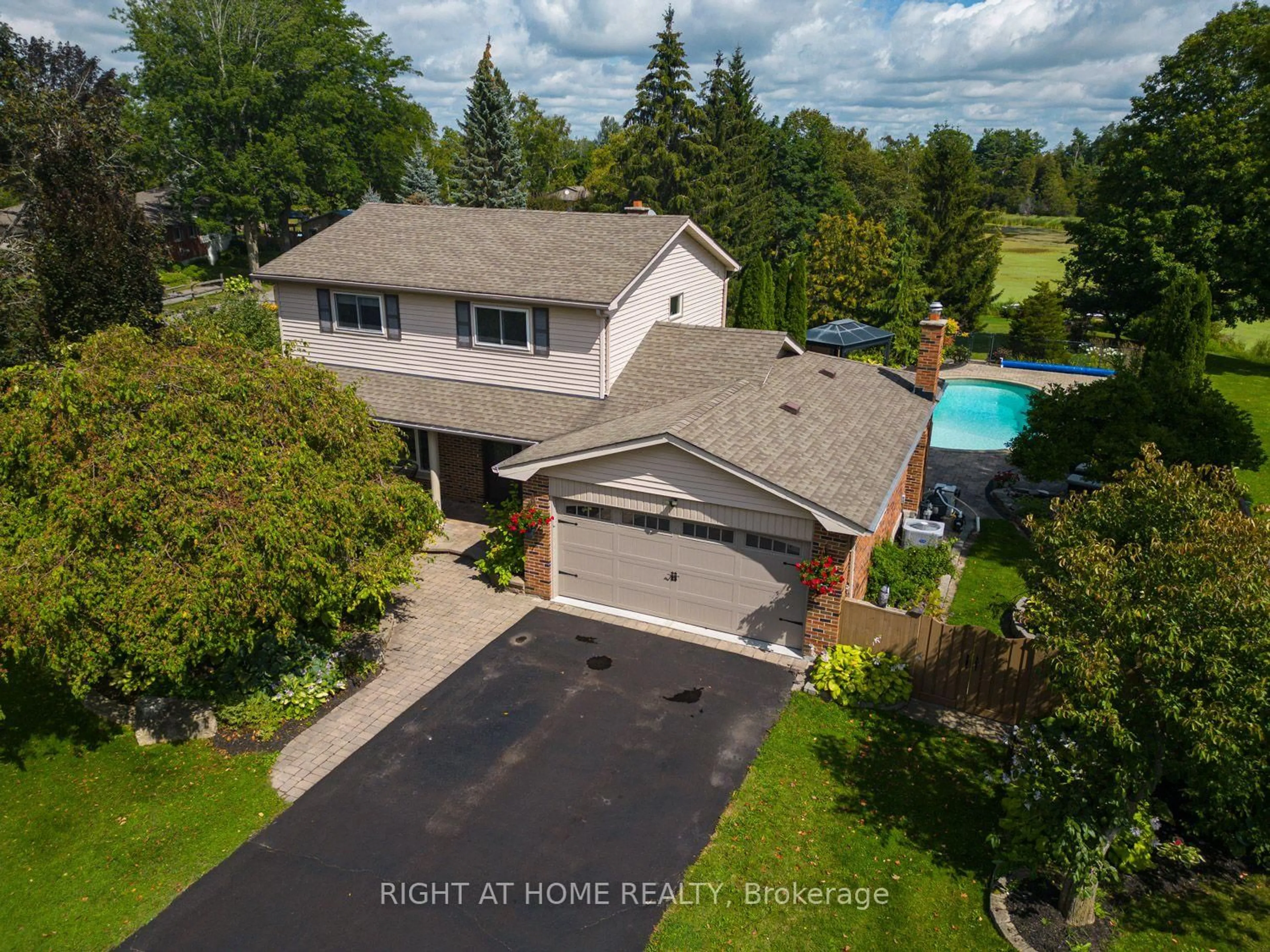 A pic from outside/outdoor area/front of a property/back of a property/a pic from drone, water/lake/river/ocean view for 63 Robinglade Ave, Kawartha Lakes Ontario L0C 1G0