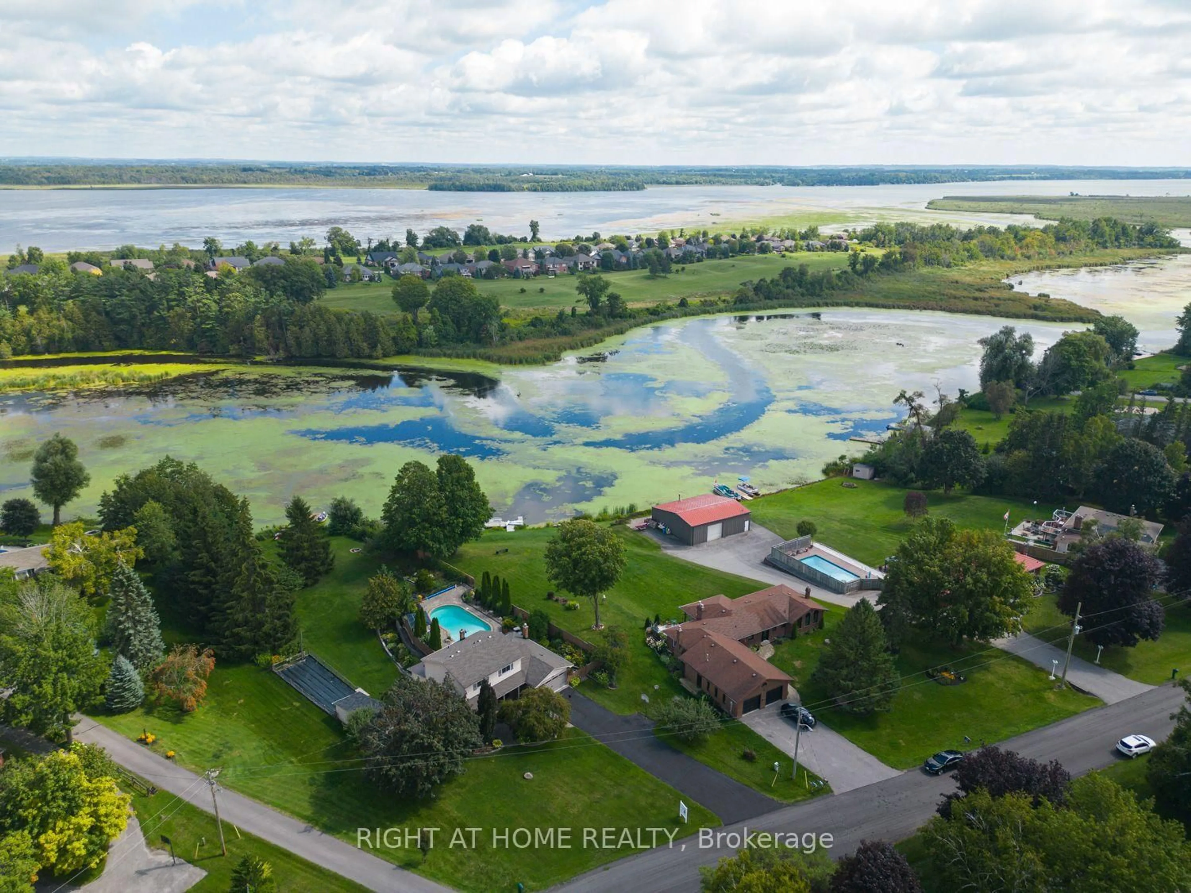 A pic from outside/outdoor area/front of a property/back of a property/a pic from drone, water/lake/river/ocean view for 63 Robinglade Ave, Kawartha Lakes Ontario L0C 1G0