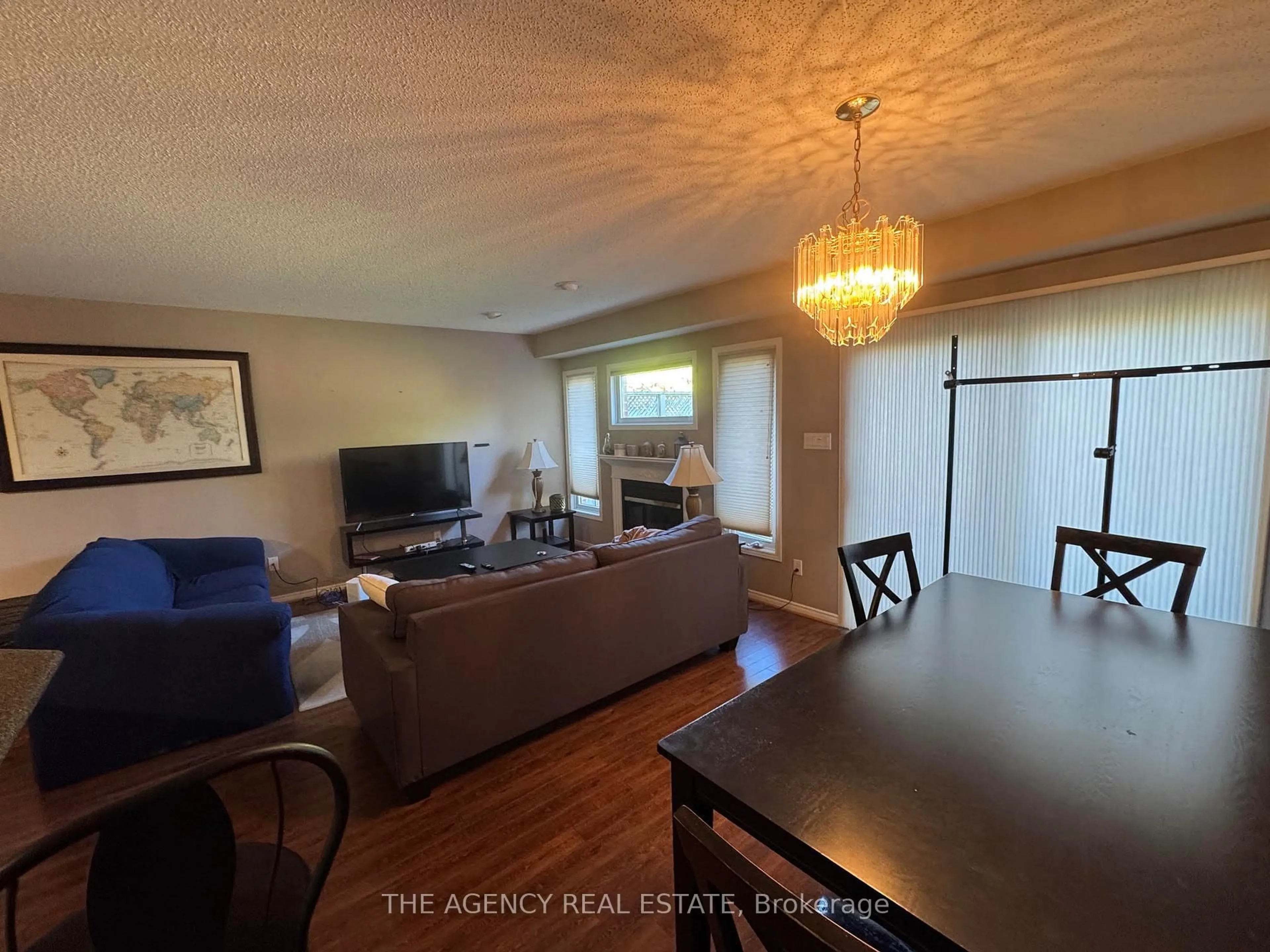 Living room with furniture, wood/laminate floor for 320 Ambleside Dr #60, London North Ontario N6G 5H9