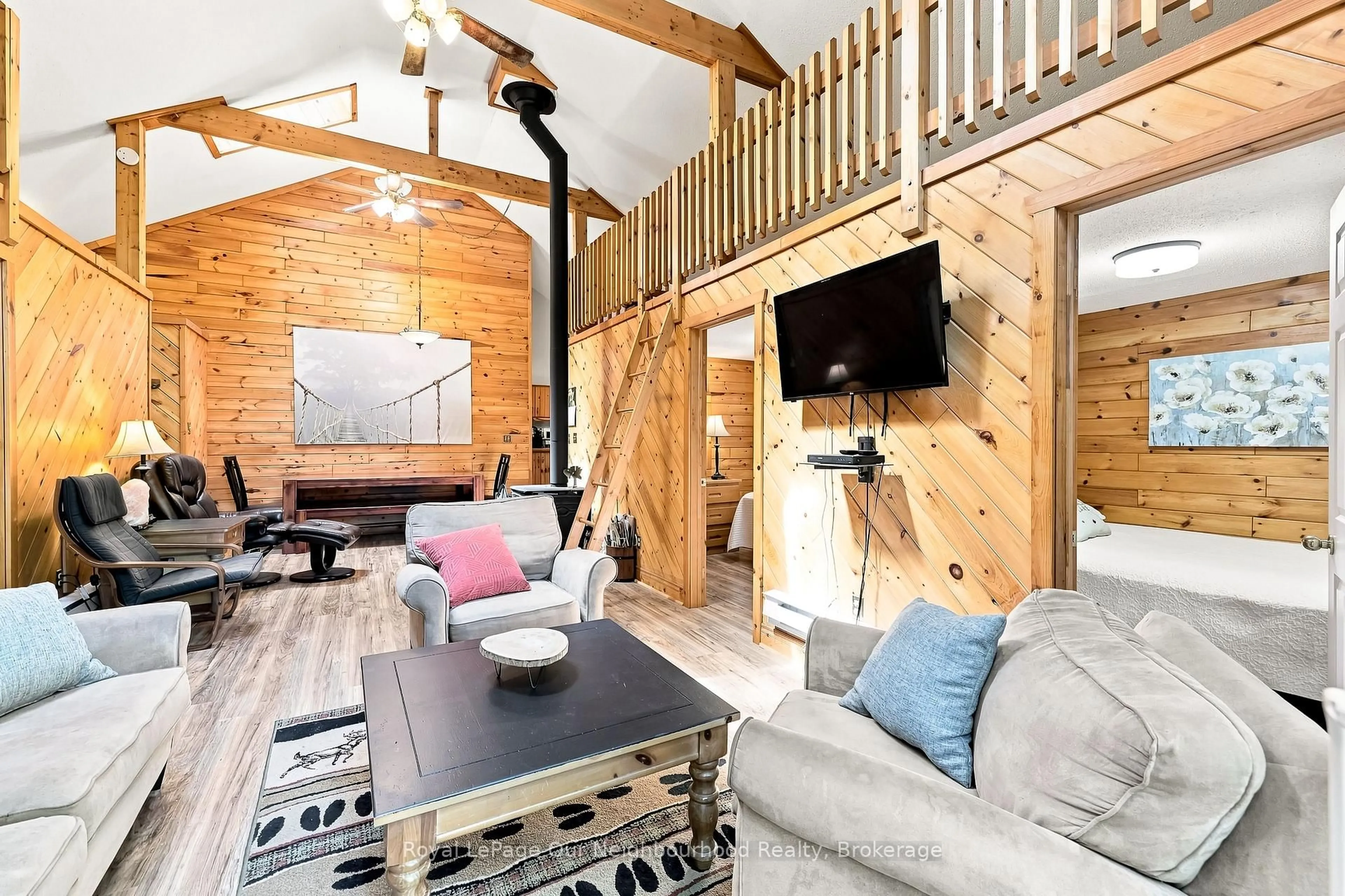 Living room with furniture, wood/laminate floor for 74 Baldwin Bay Rd, Trent Lakes Ontario K0L 1J0