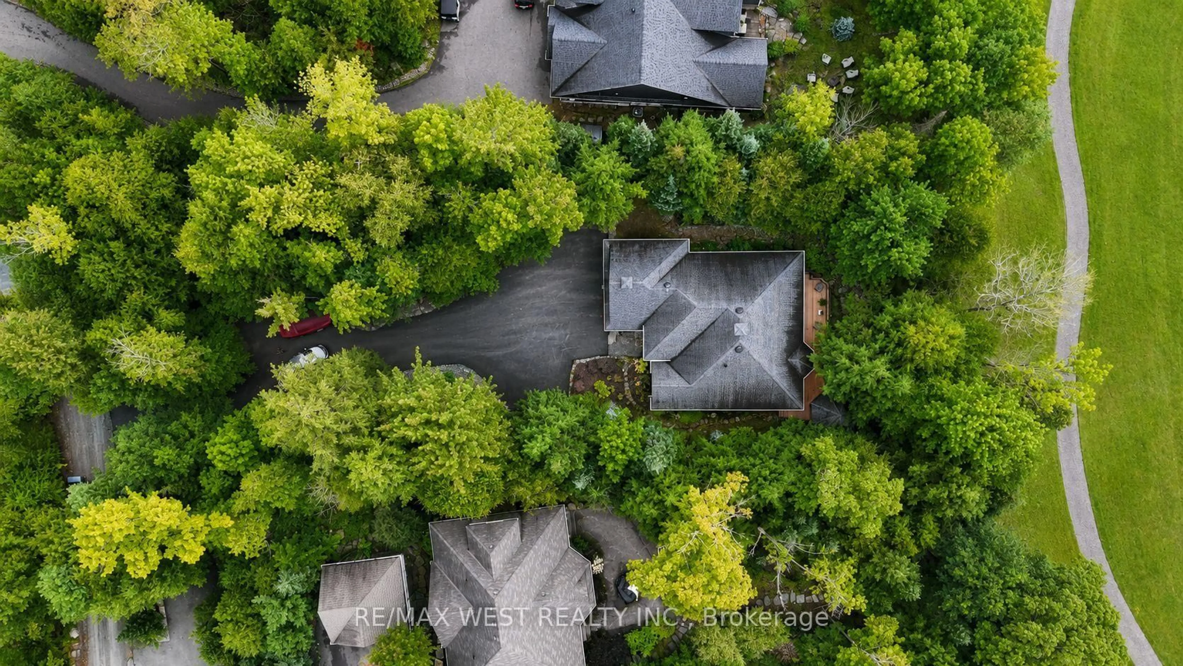 A pic from outside/outdoor area/front of a property/back of a property/a pic from drone, forest/trees view for 20 Deerhurst Highlands Dr, Huntsville Ontario P1H 1B1