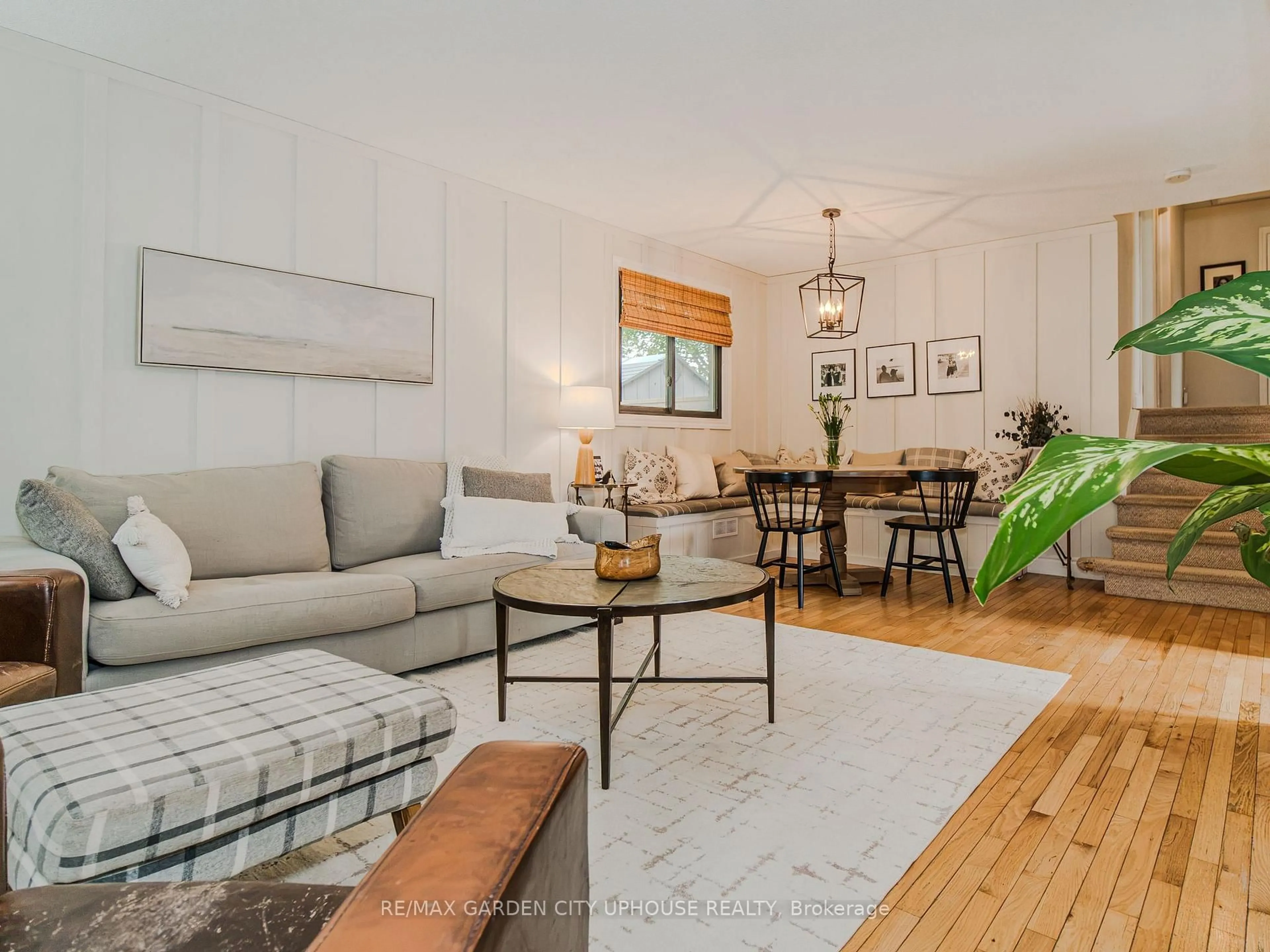 Living room with furniture, wood/laminate floor for 24 Greenmeadow Crt, St. Catharines Ontario L2N 6Y8