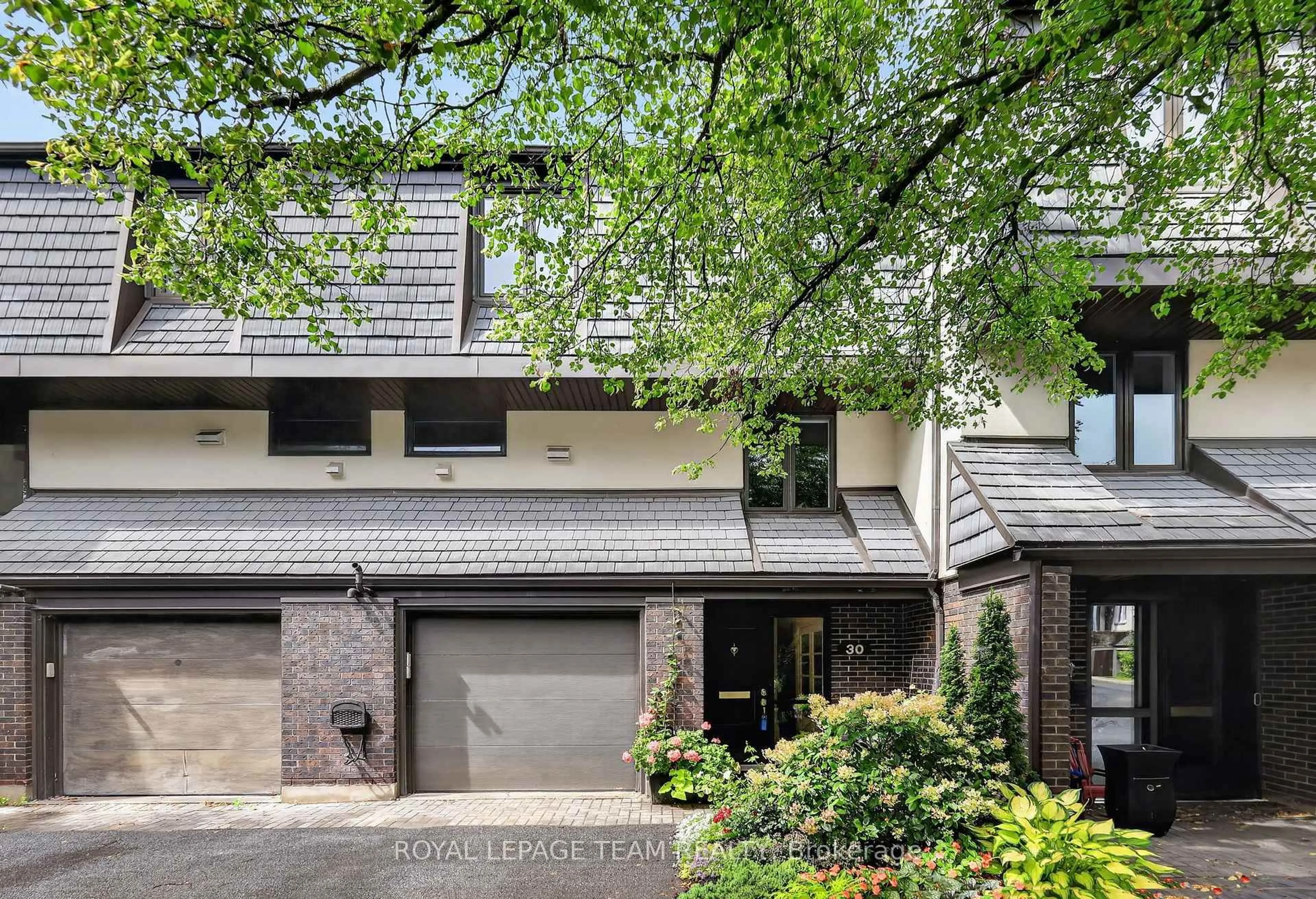 Home with brick exterior material, street for 655 Richmond Rd #30, Ottawa Ontario K2A 3Y3