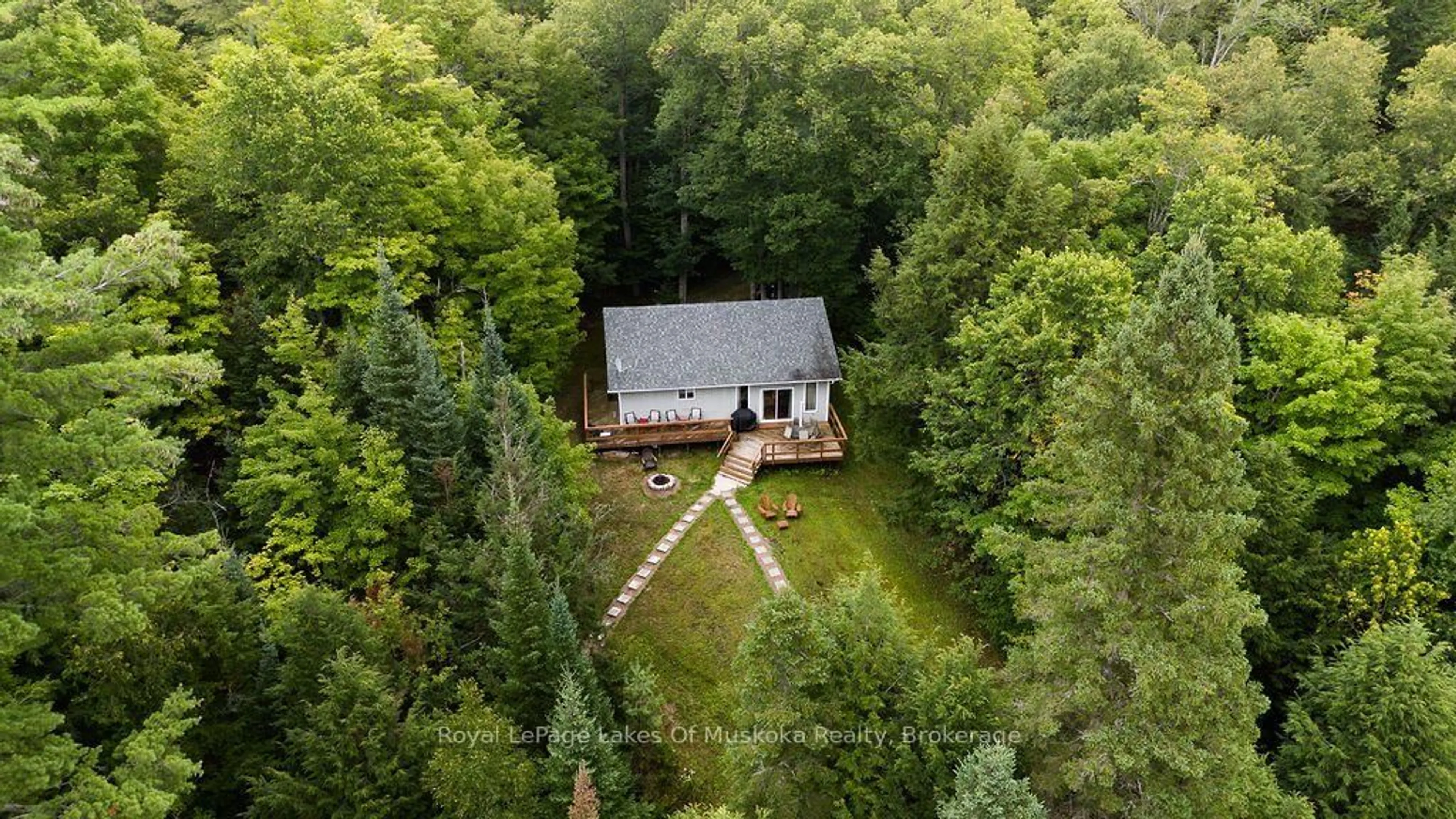 A pic from outside/outdoor area/front of a property/back of a property/a pic from drone, forest/trees view for 215 Sandwood Dr, Ryerson Ontario P0A 1C0