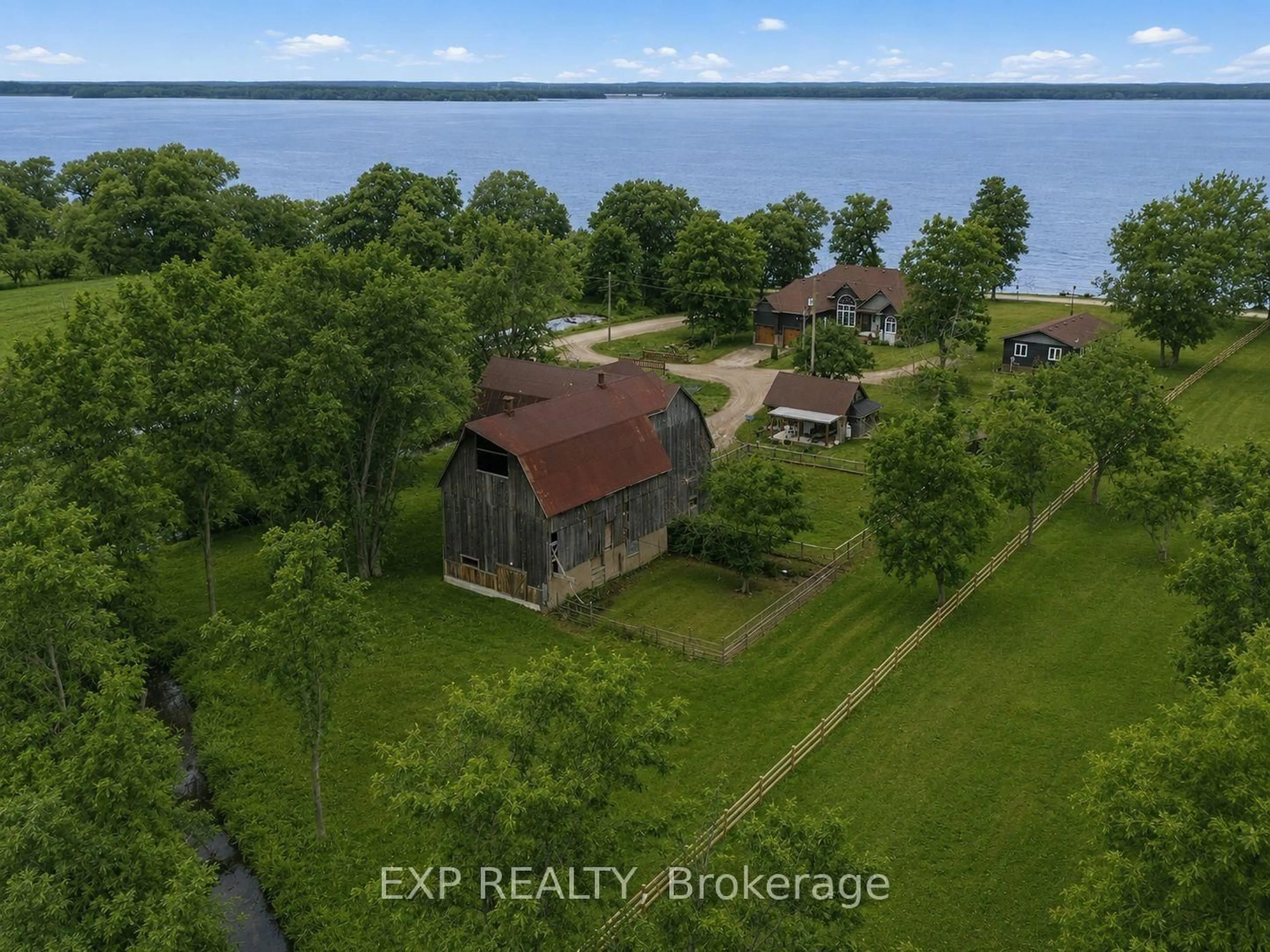 A pic from outside/outdoor area/front of a property/back of a property/a pic from drone, water/lake/river/ocean view for 516 ALLISON Rd, Prince Edward County Ontario K0K 1W0