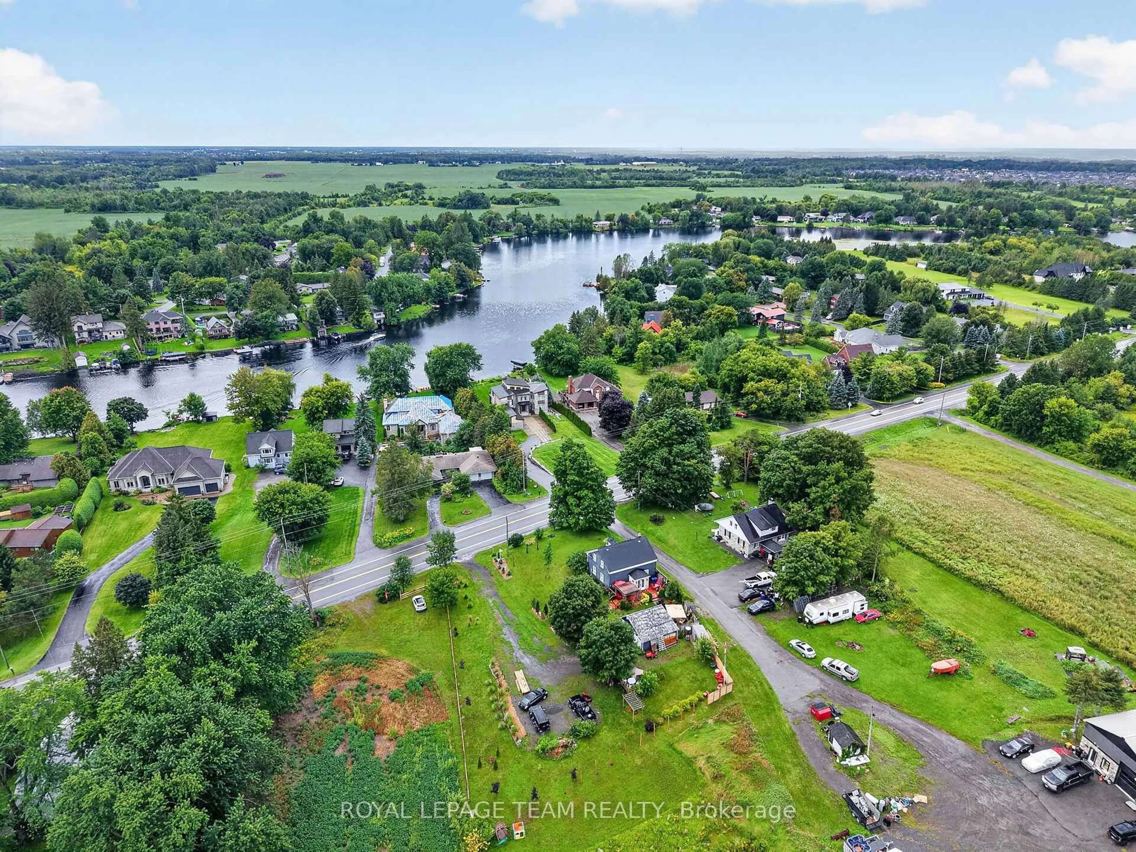A pic from outside/outdoor area/front of a property/back of a property/a pic from drone, water/lake/river/ocean view for 1629 River Rd, Ottawa Ontario K4M 1B4