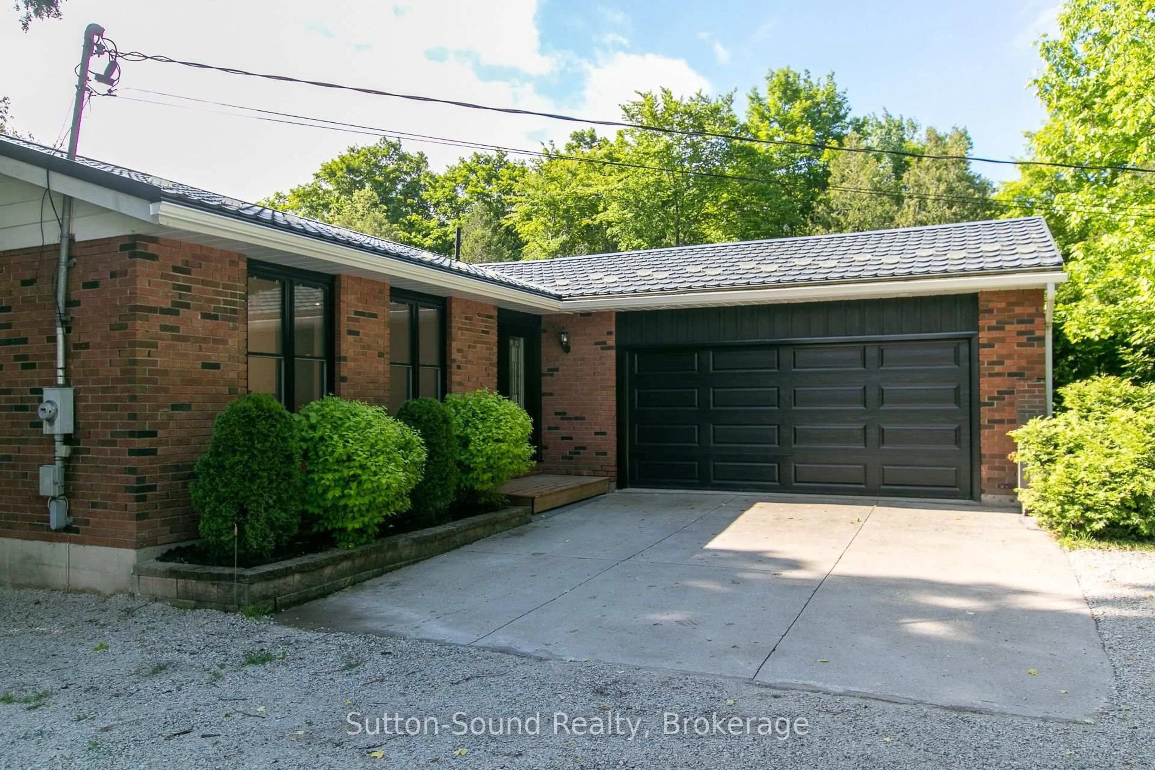 Home with brick exterior material, street for 318743 Grey Road 1 Rd, Georgian Bluffs Ontario N4K 5N4