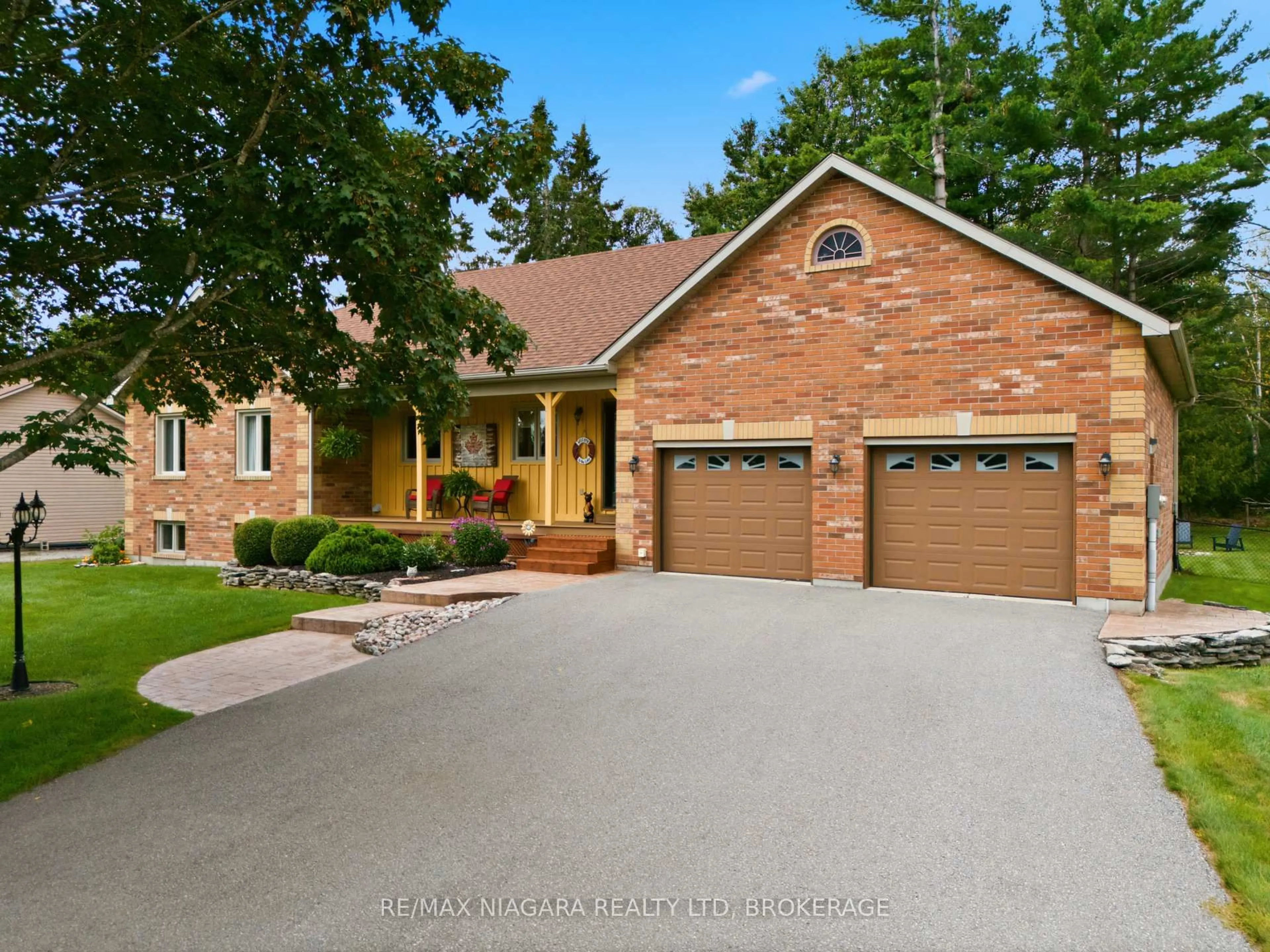 Home with brick exterior material, street for 115 Pinewood Blvd, Kawartha Lakes Ontario K0M 2T0